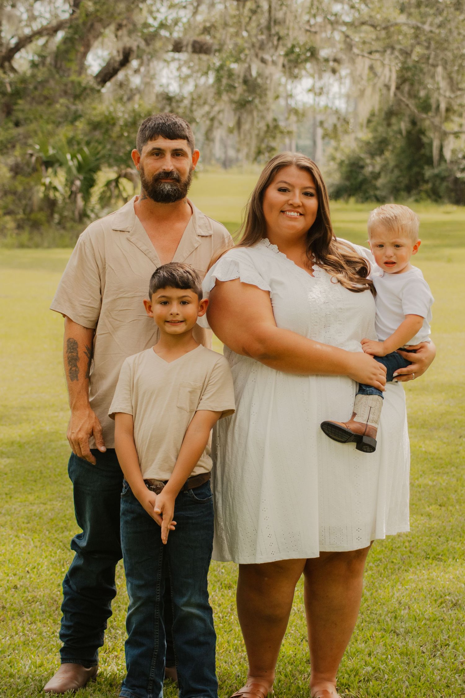 A series of cropped family portraits on grass showing different poses and groupings in warm natural lighting.