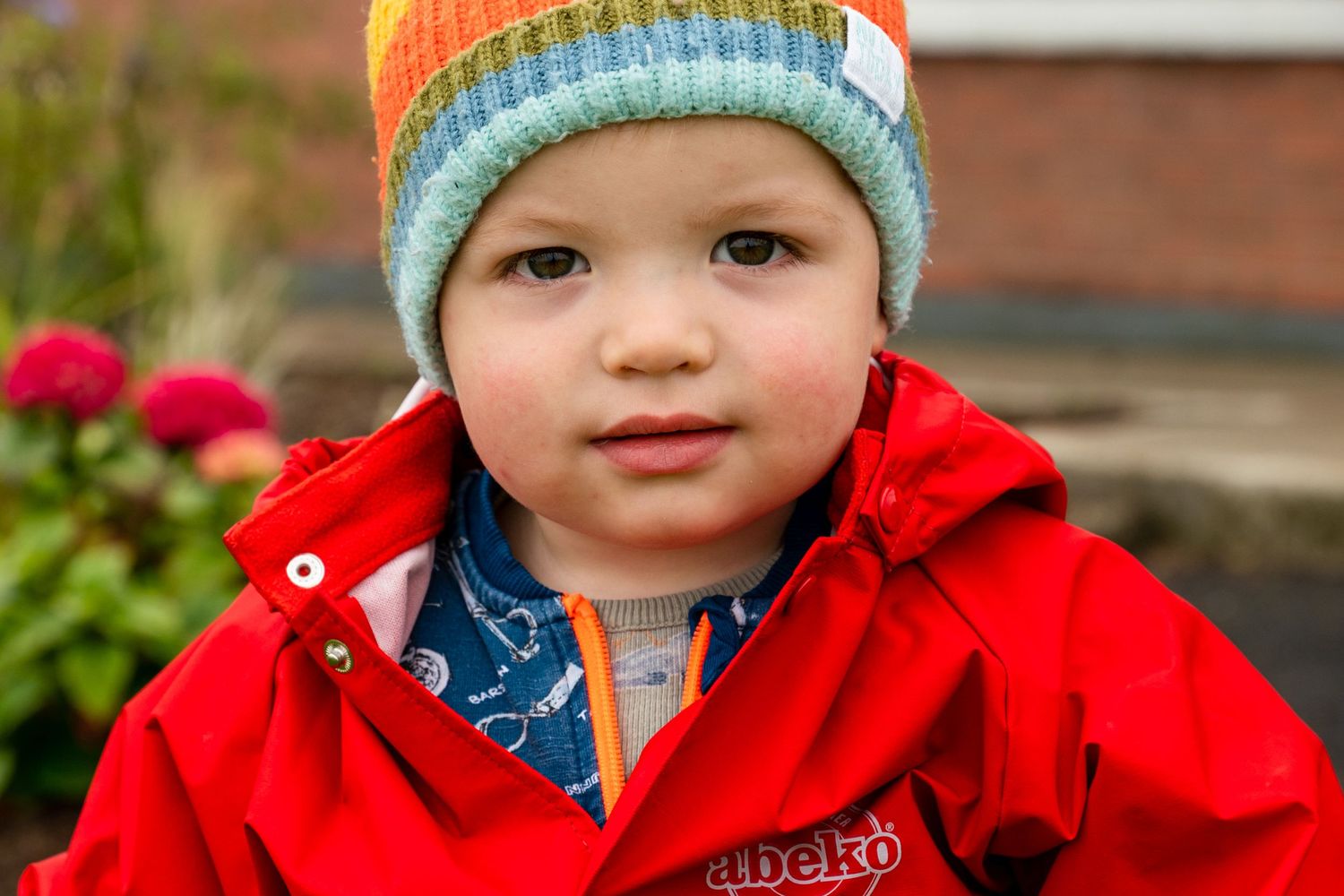 toddler family documentary  photography red coat colourful hat outside waterford