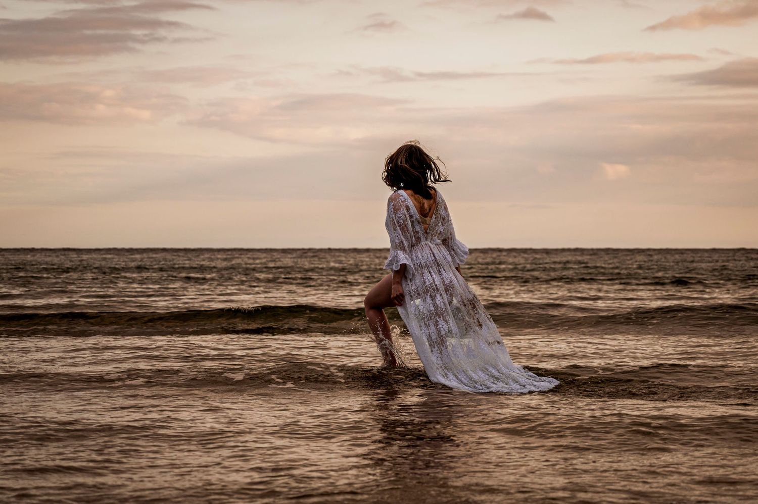 eleanor barry photography waterford munster maternity session beach goat island ardmore pregnant lady in the water in white maternity dress