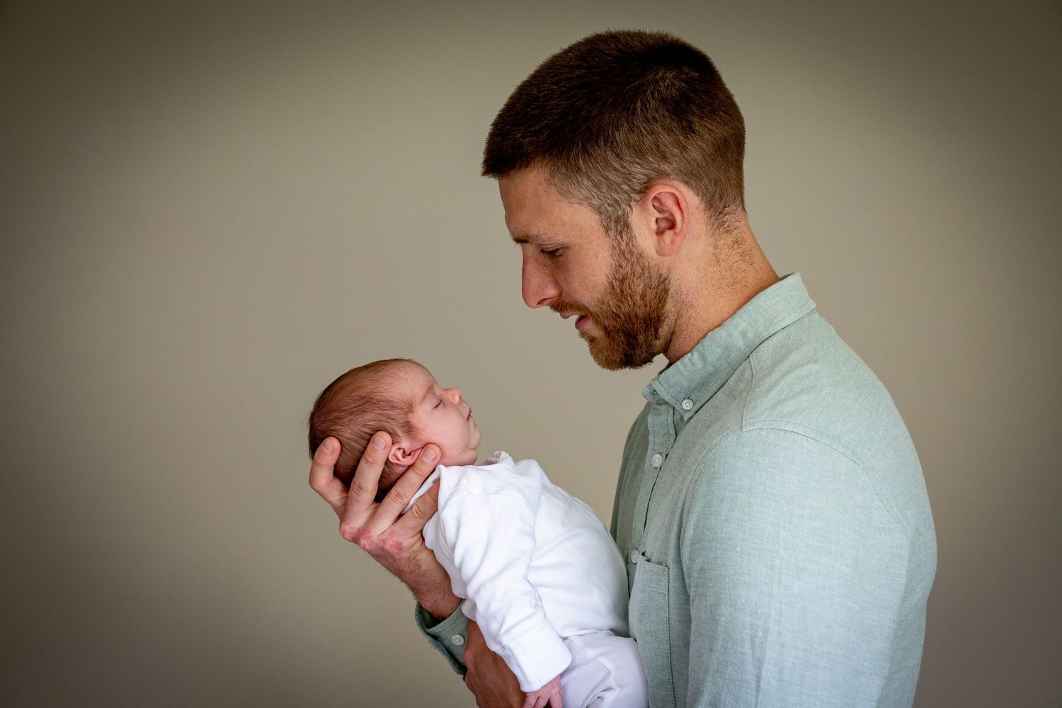 father holding baby waterford  newborn photography