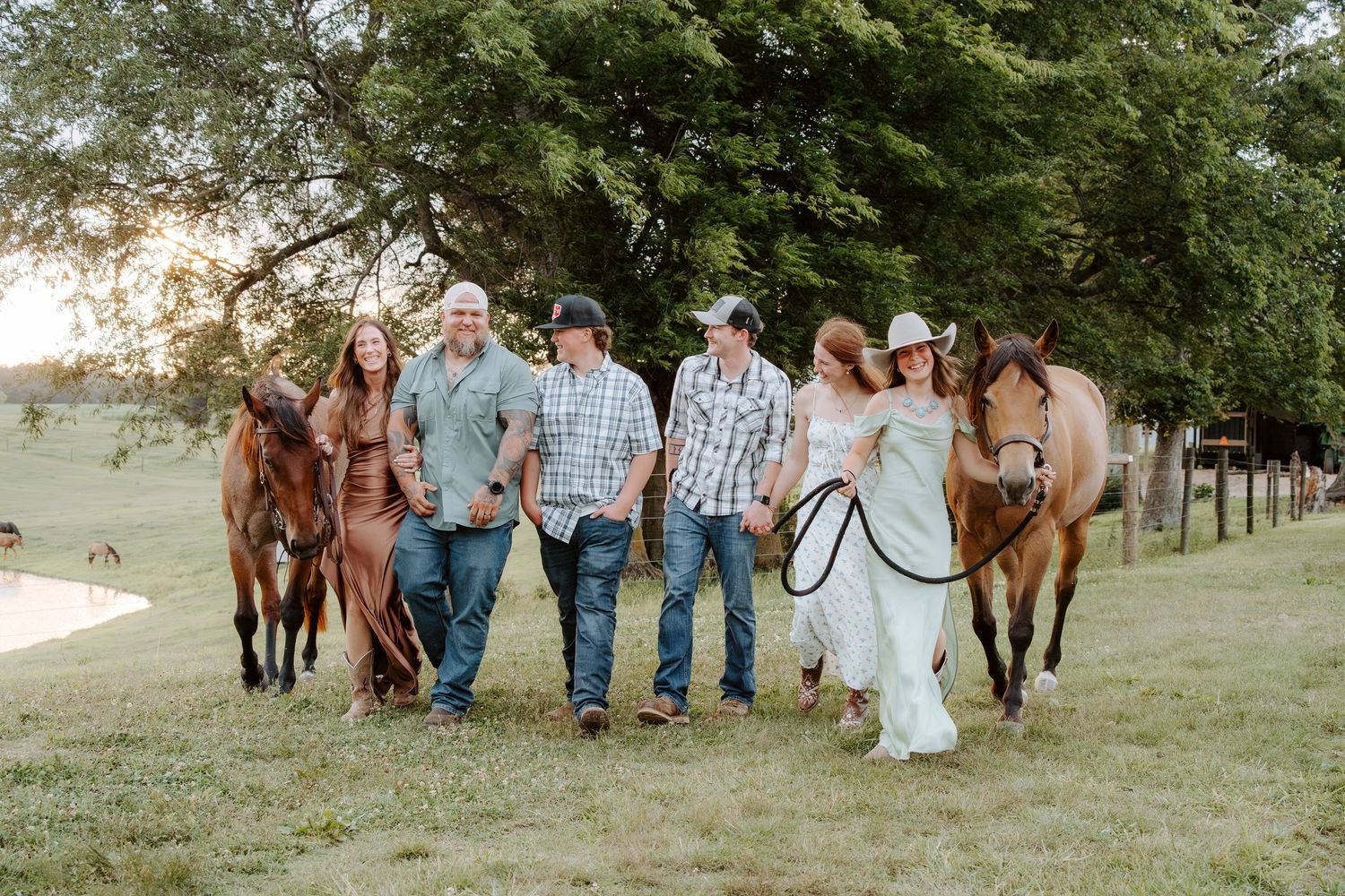 Family walking together with horses