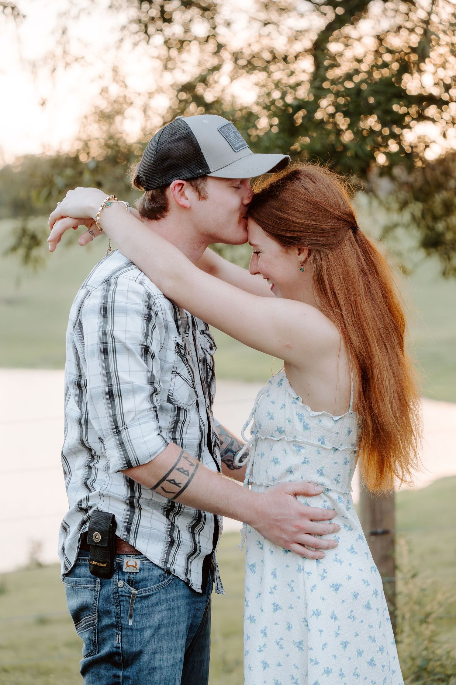 Man kissing wife on the forehead