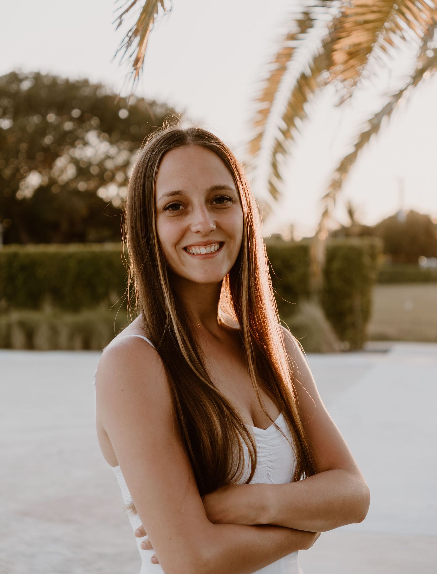 Girl smiling at camera in the golden sunlight