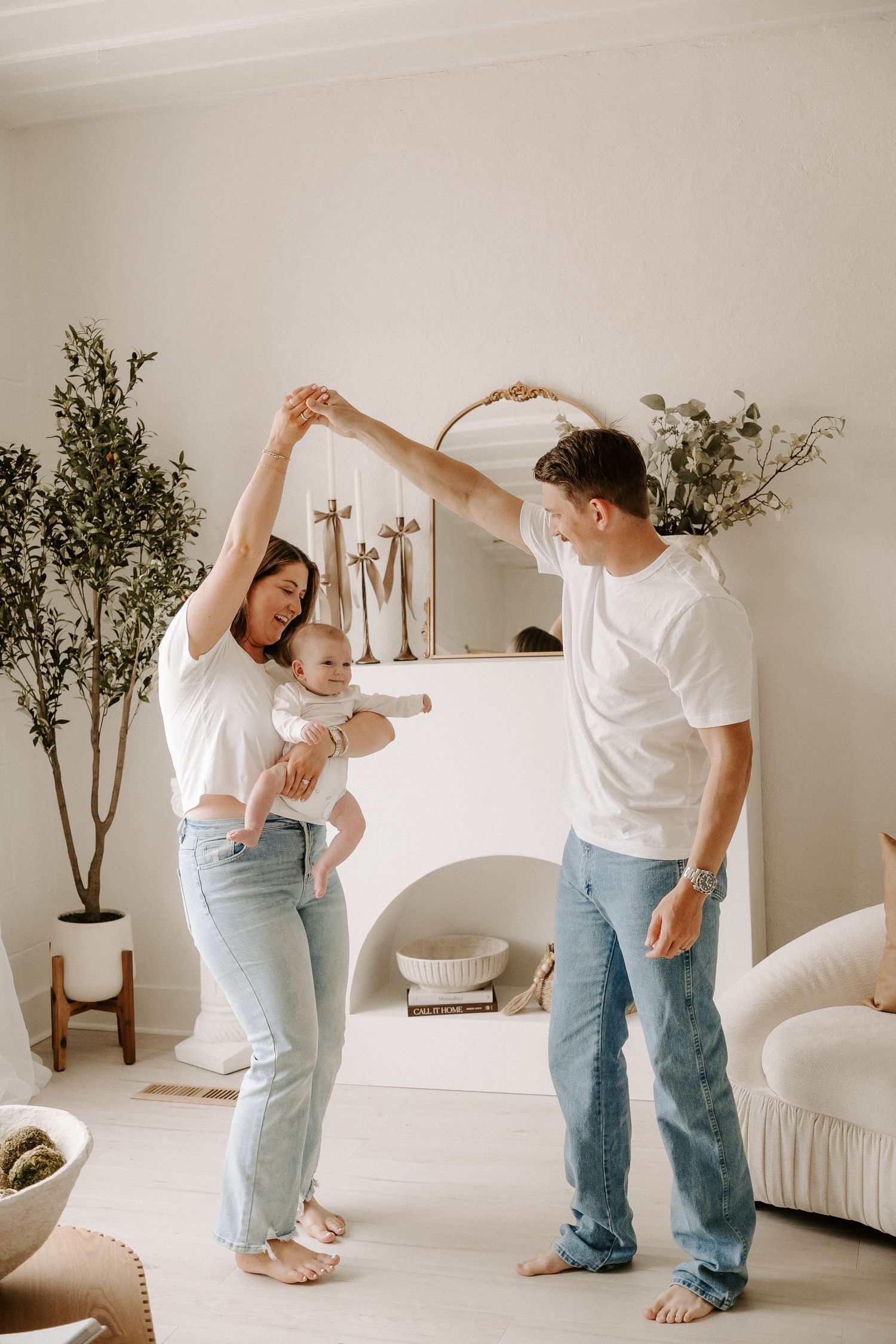 Dad and mom dancing with baby