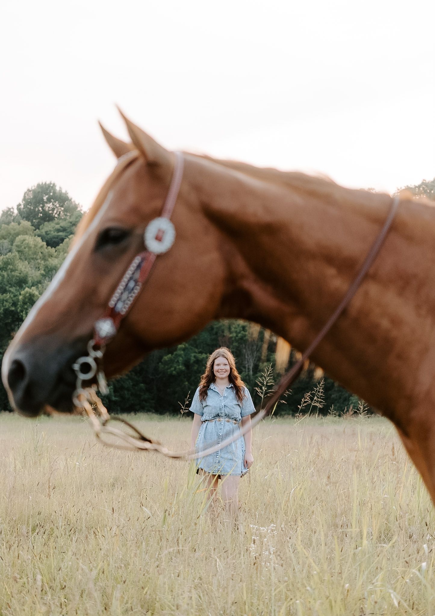 Girl standing in grassy field