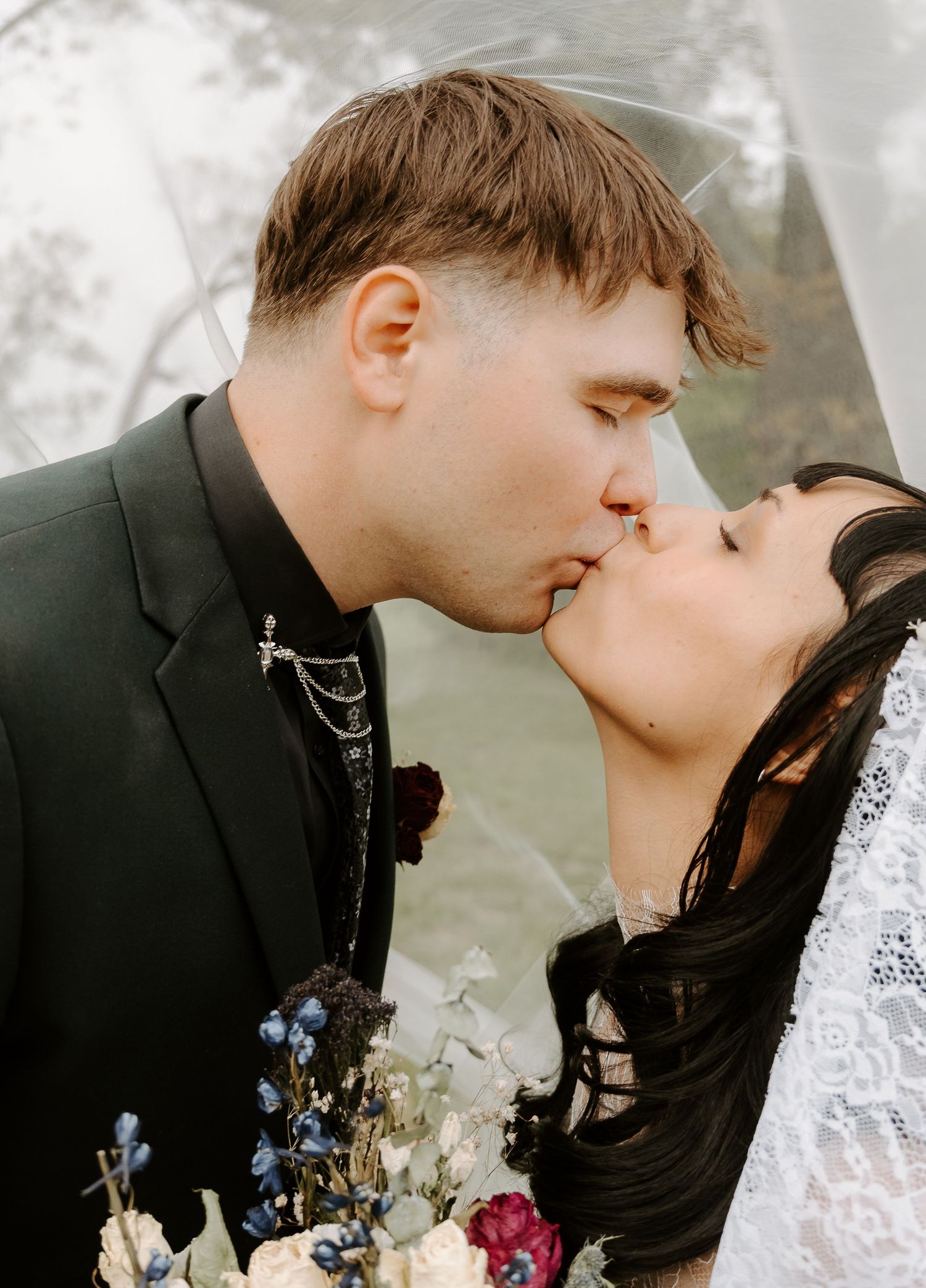 Bride and groom kissing each other