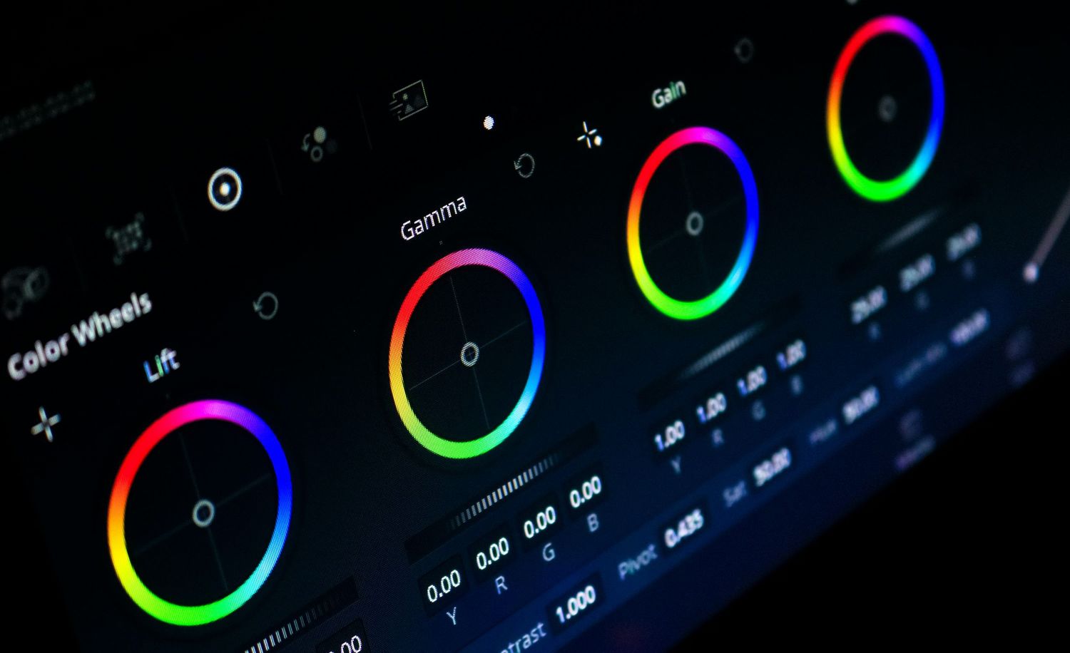 Color wheels interface on a dark screen showing Lift, Gamma, and Gain controls for professional video color grading.