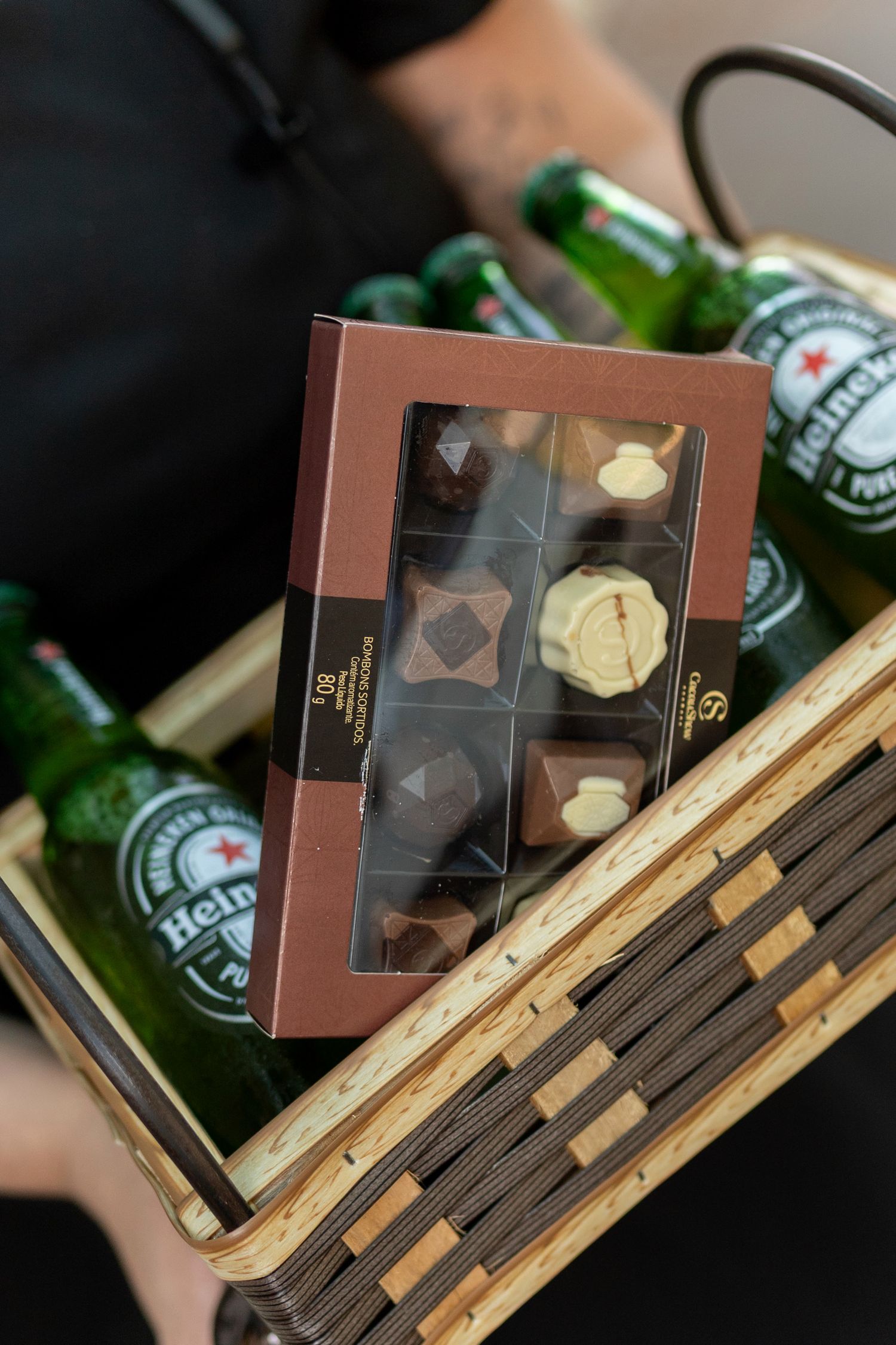 Gift basket with Heineken bottles and assorted chocolates box.