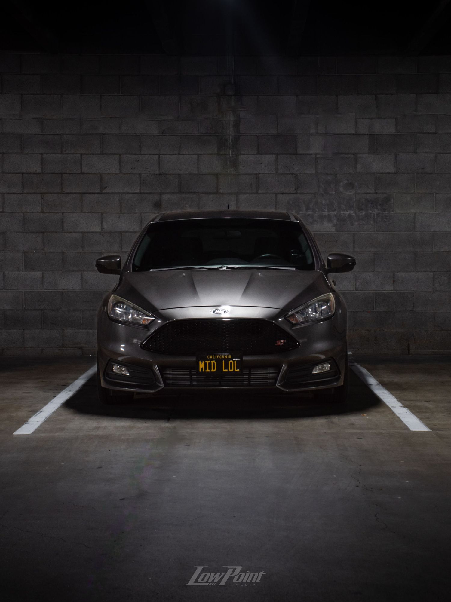 Magnetic Grey Ford Focus ST photographed in parking garage under a moody light