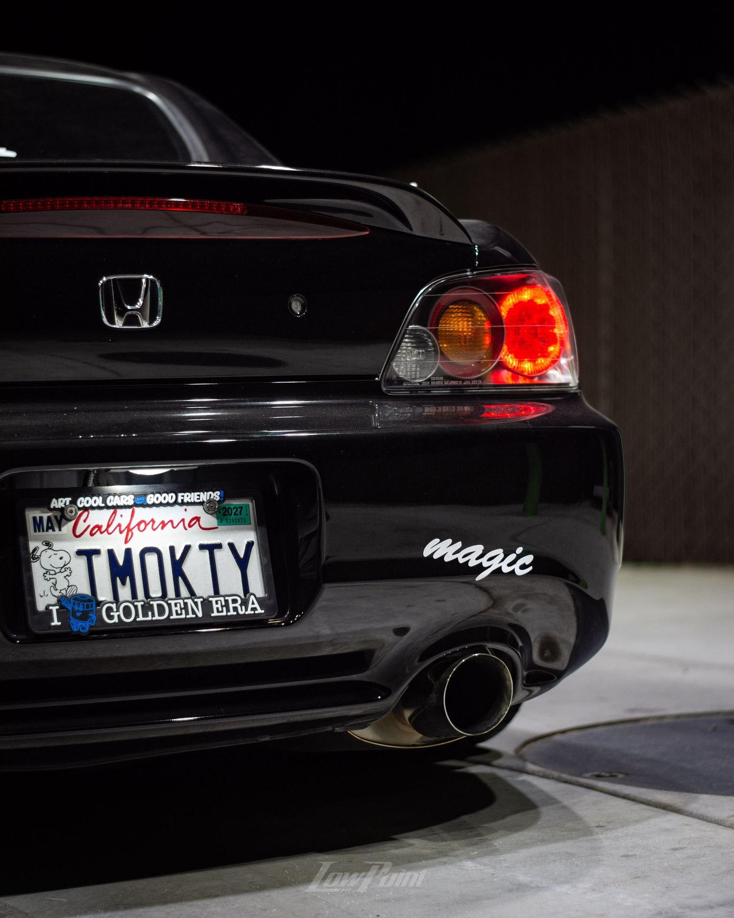 Black Honda S2000 photographed at night at a gas pump with white Work wheels