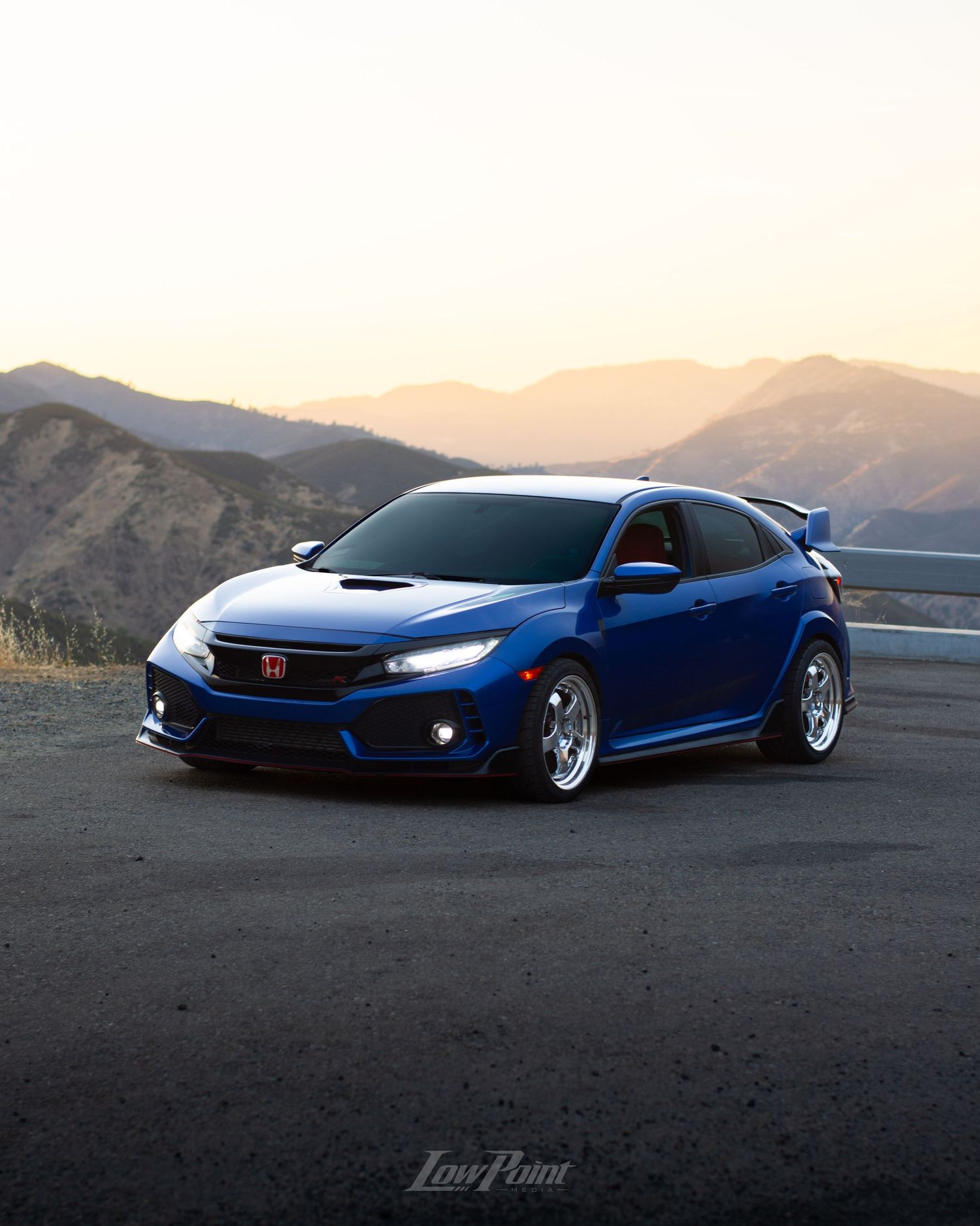 Blue Honda Civic Type-R photographed with GMR wheels at golden hour from a high vista point