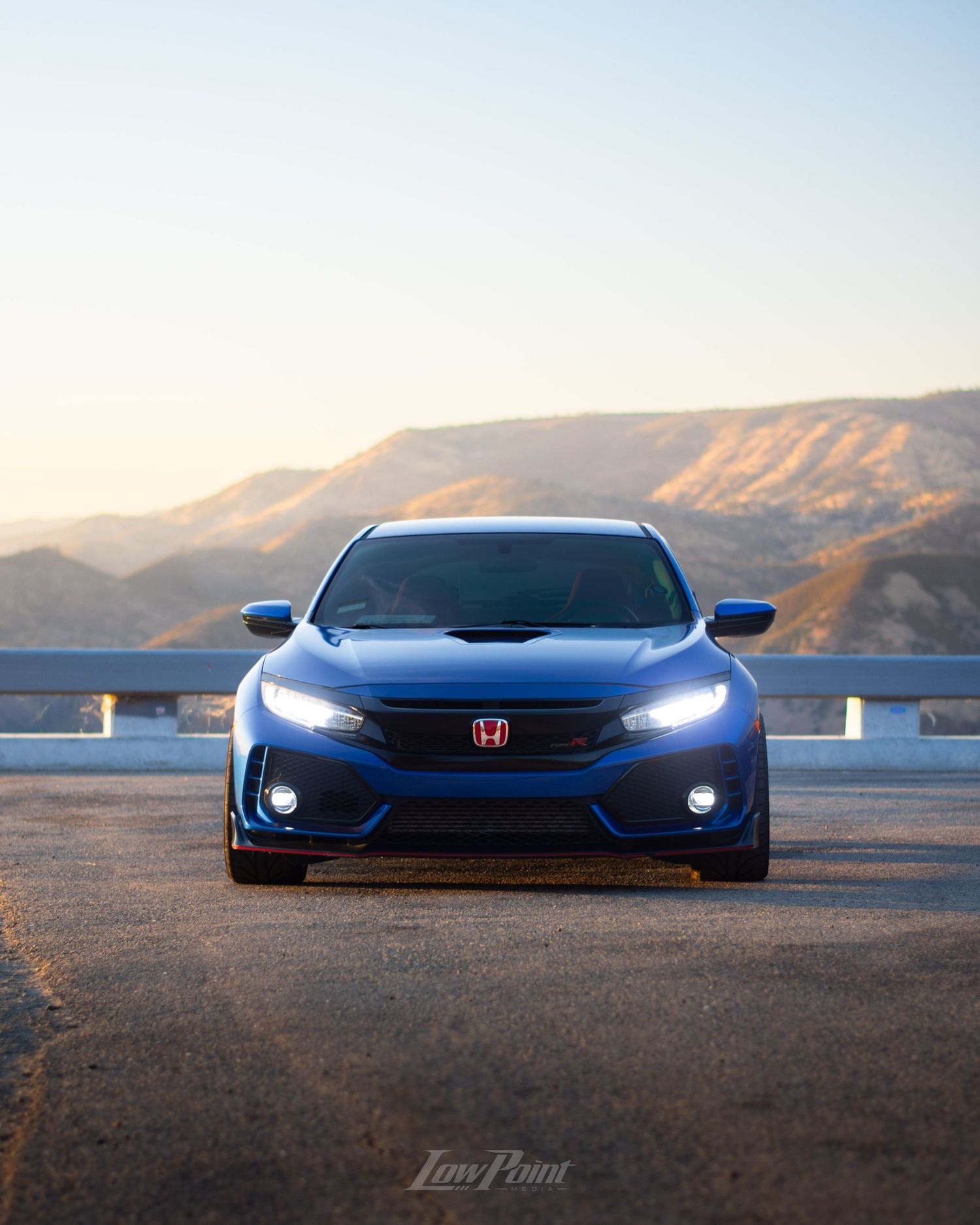 Blue Honda Civic Type-R photographed with GMR wheels at golden hour from a high vista point