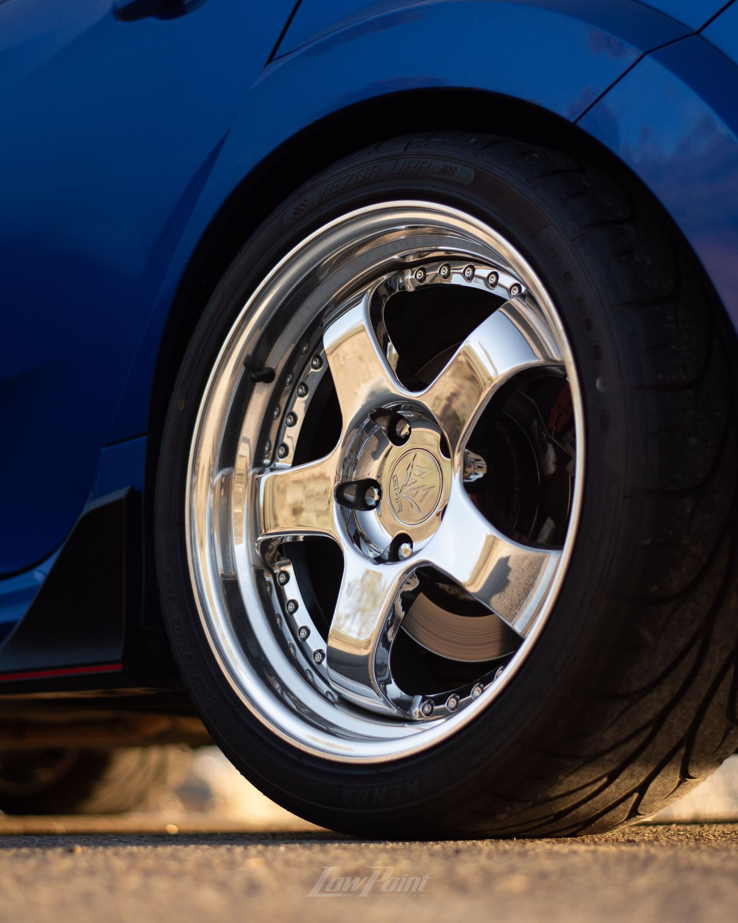 Blue Honda Civic Type-R photographed with GMR wheels at golden hour from a high vista point