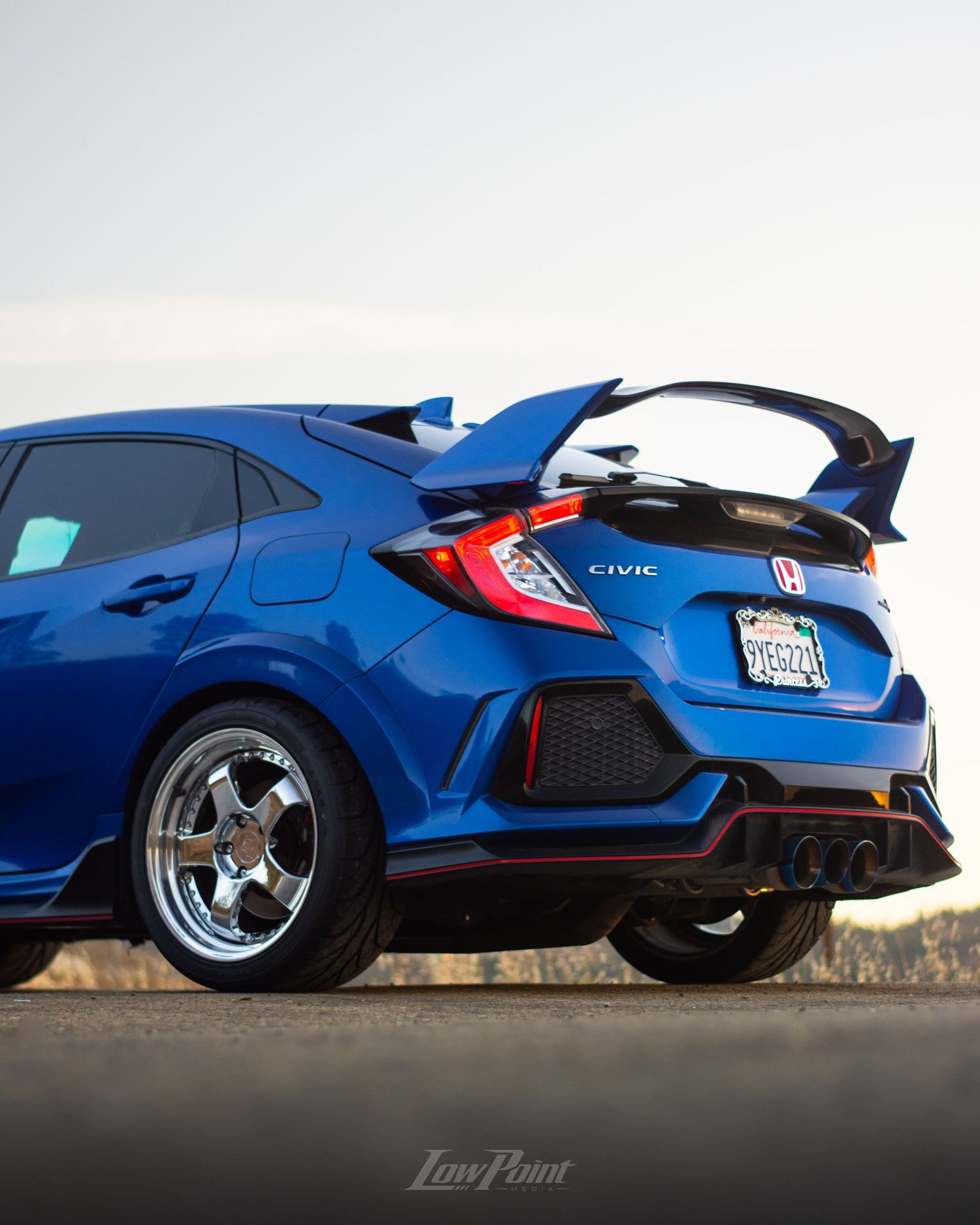 Blue Honda Civic Type-R photographed with GMR wheels at golden hour from a high vista point