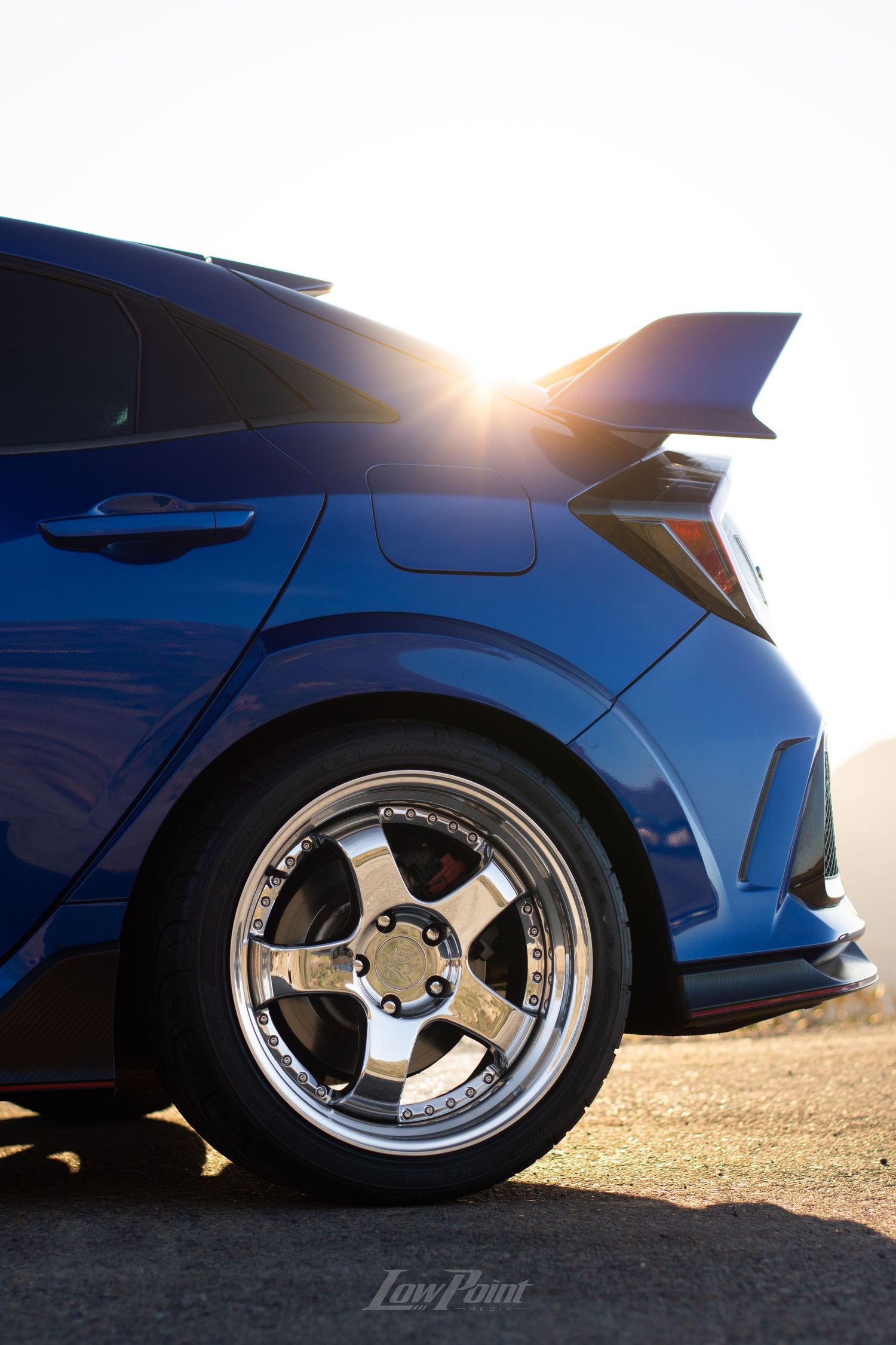 Blue Honda Civic Type-R photographed with GMR wheels at golden hour from a high vista point
