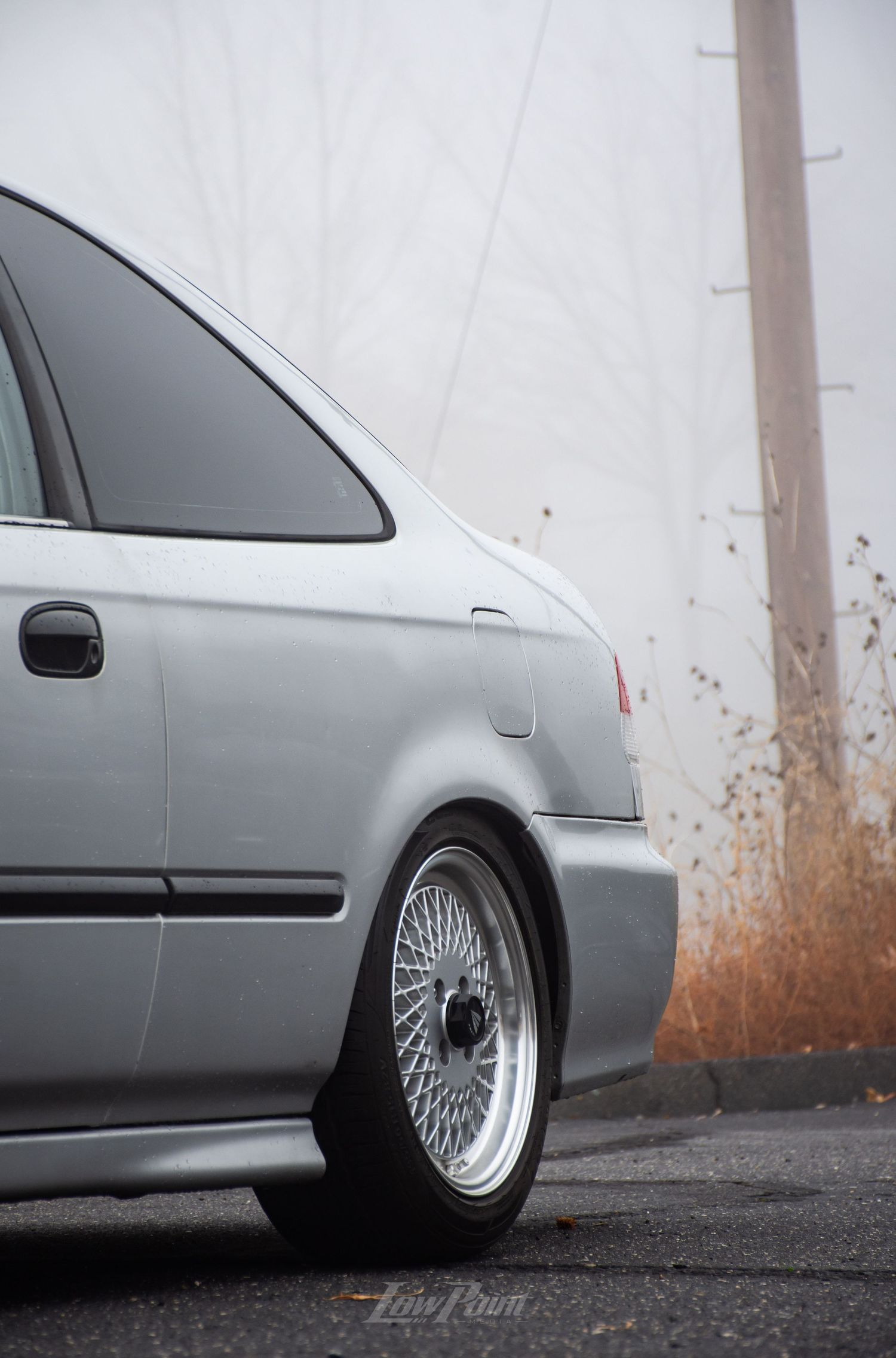 Silver Honda Civic photographed on a foggy day