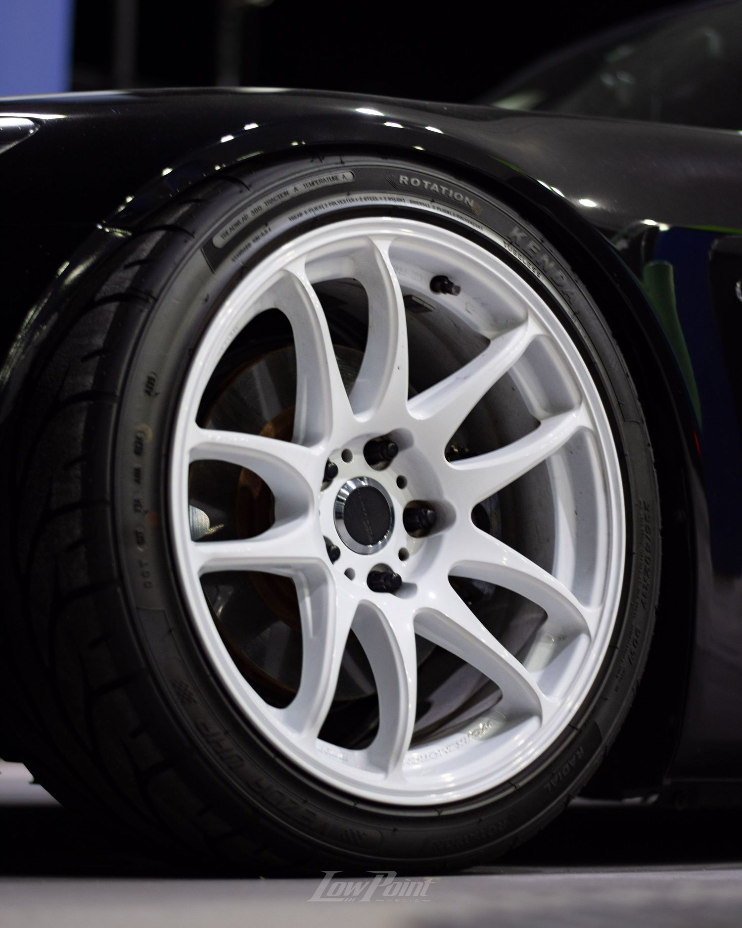 Black Honda S2000 photographed at night at a gas pump with white Work wheels