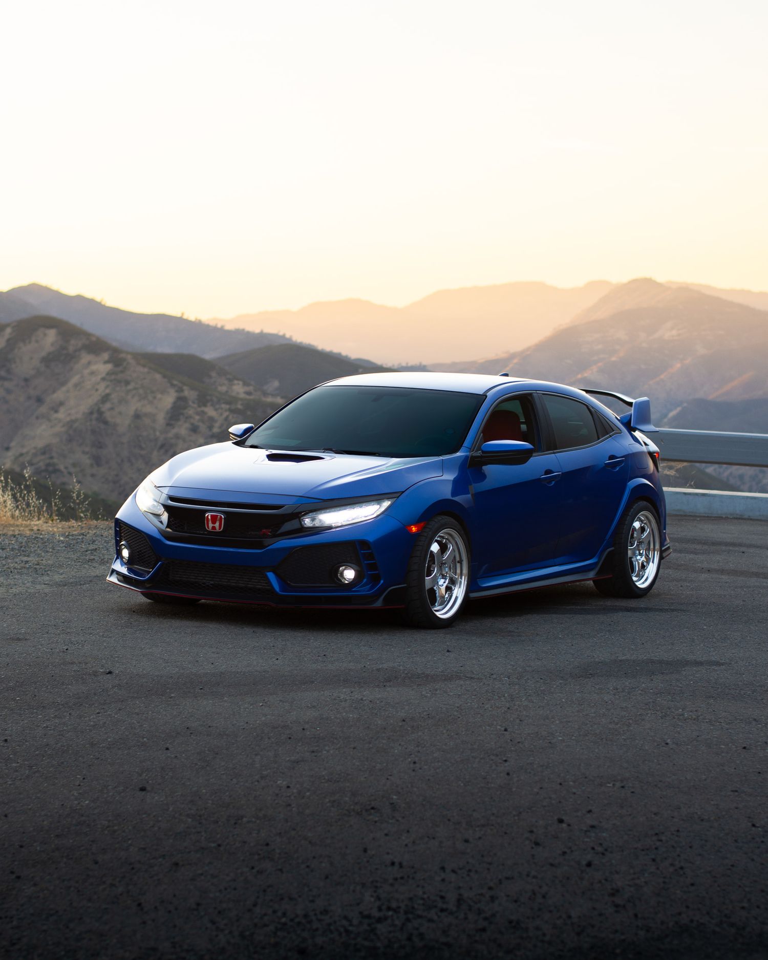 Blue Honda Civic Type-R photographed with GMR wheels at golden hour from a high vista point