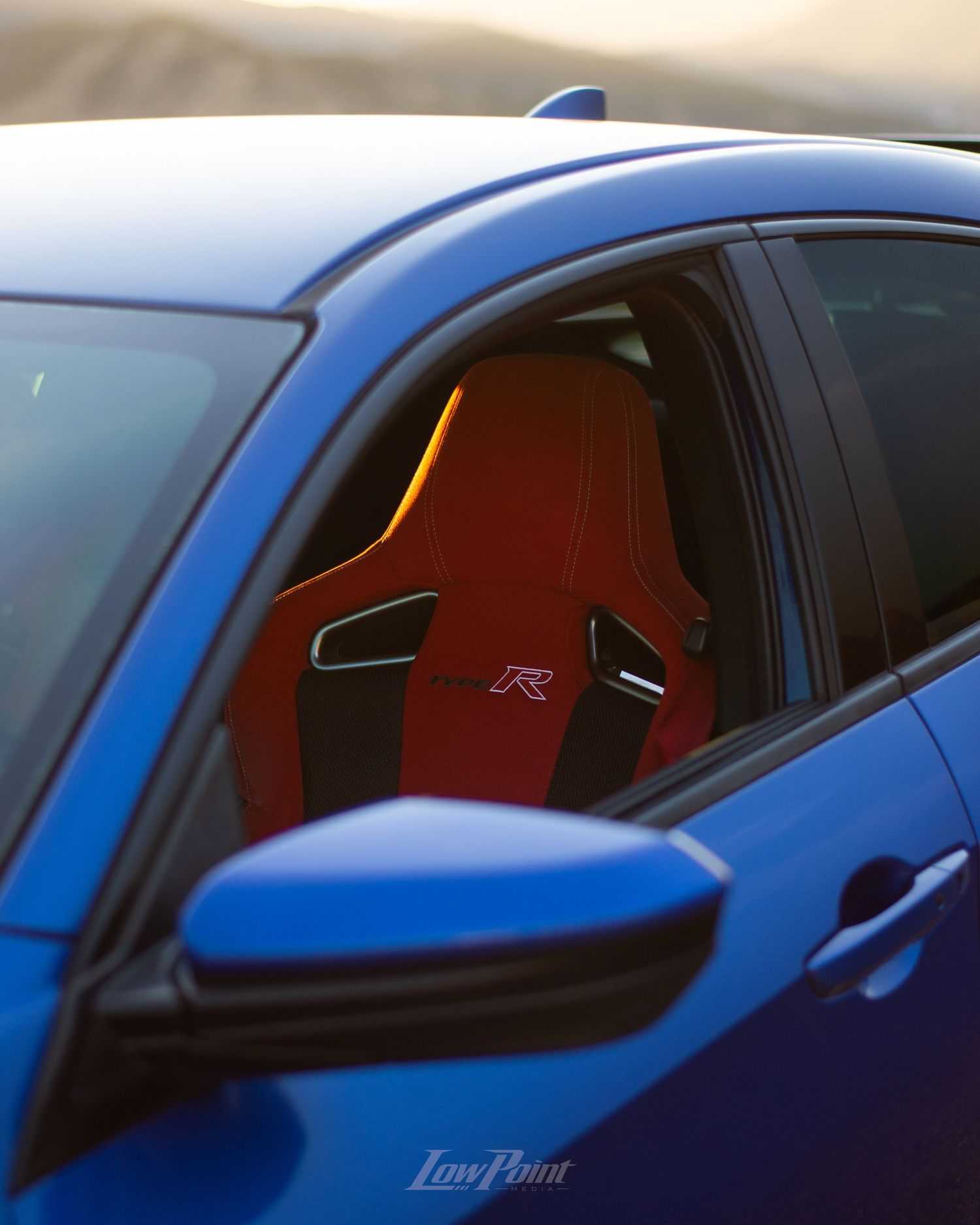 Blue Honda Civic Type-R photographed with GMR wheels at golden hour from a high vista point