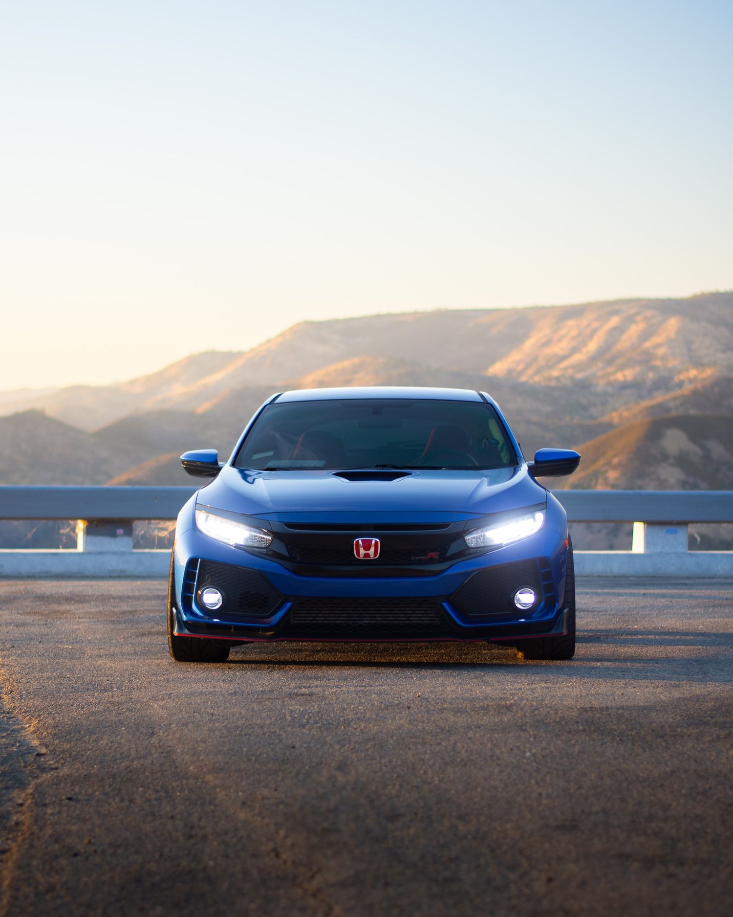 Blue Honda Civic Type-R photographed with GMR wheels at golden hour from a high vista point