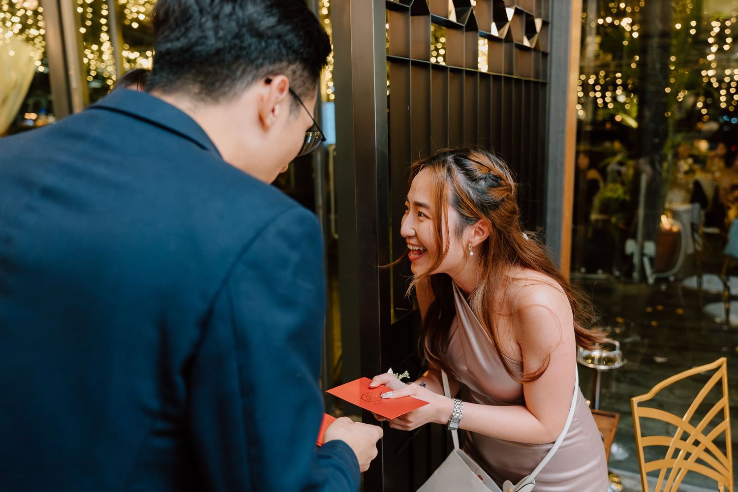 Romantic outdoor restaurant scene with couple sharing a special moment during sunset dining.