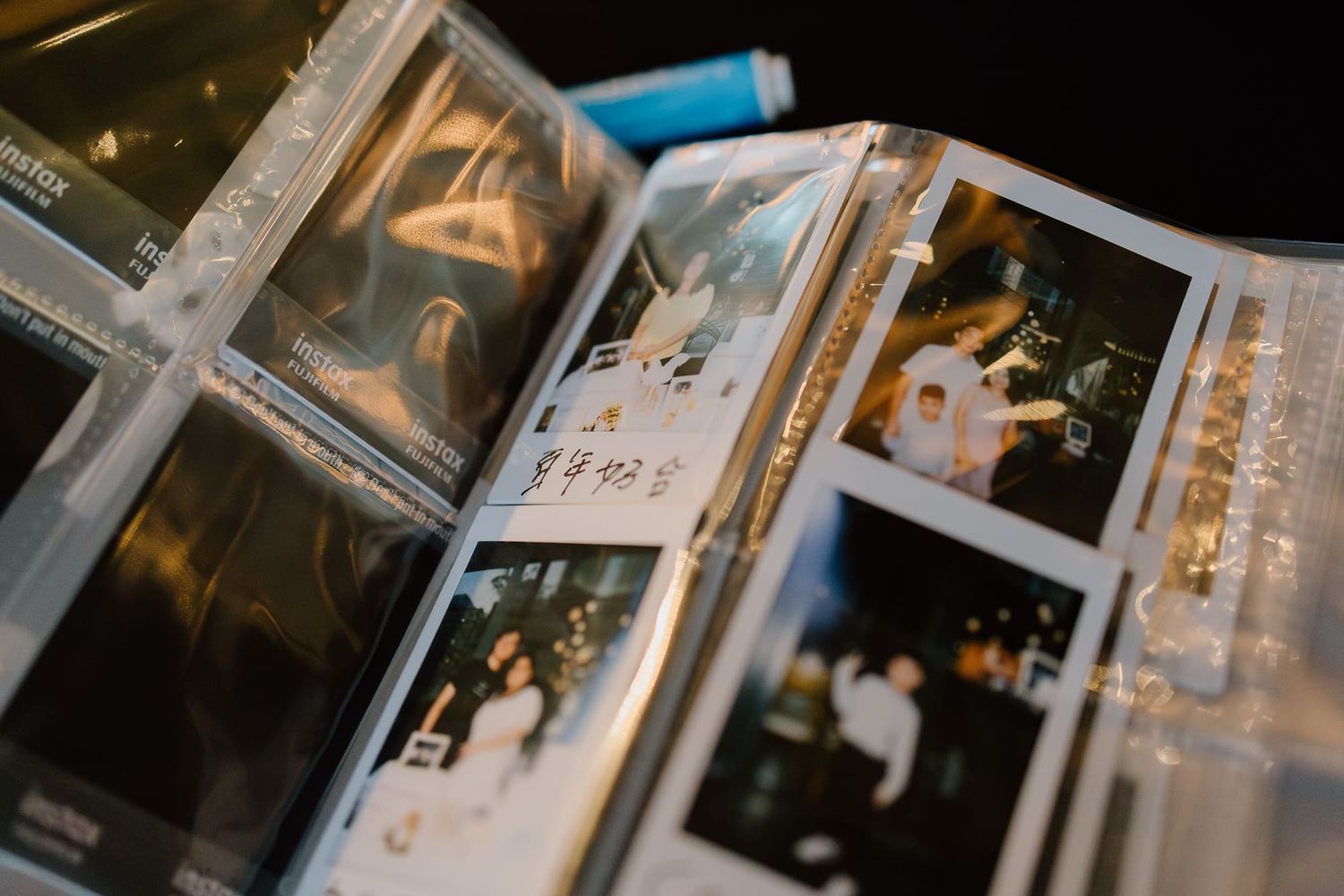 Several vintage-style Polaroid instant photos and prints are arranged and displayed together in a nostalgic spread.