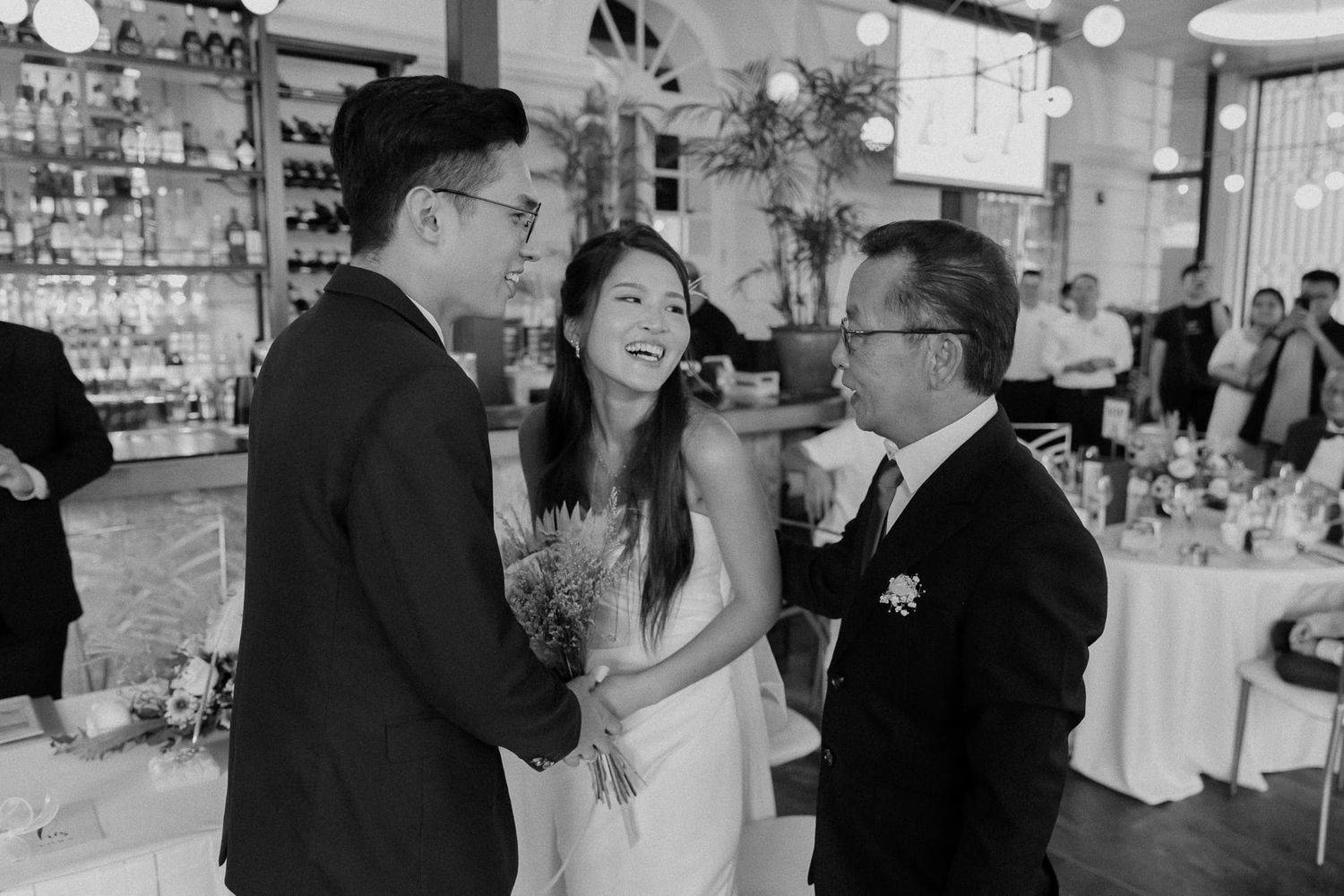 Black and white wedding reception photos show couples dancing and enjoying intimate moments on the dance floor.