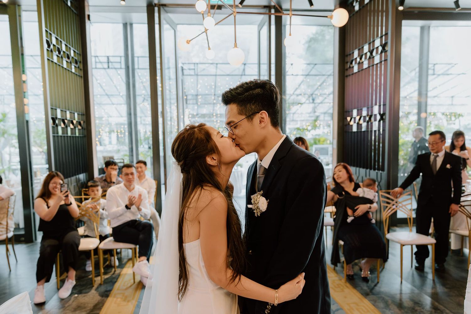 A collage of romantic dance moments captured at a modern wedding reception venue with floor-to-ceiling windows.