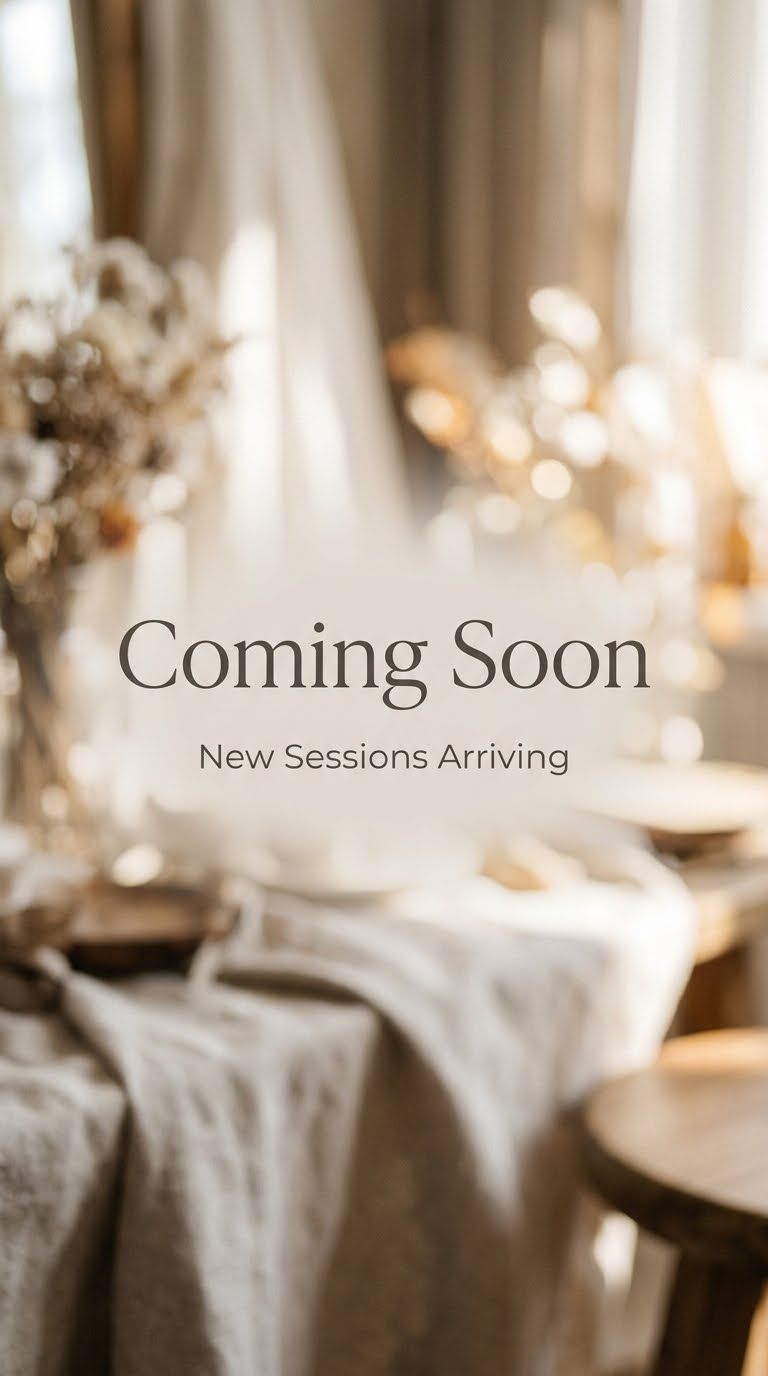 Elegant coming soon announcement with blurred neutral-toned table setting, dried florals, and soft bokeh lighting.
