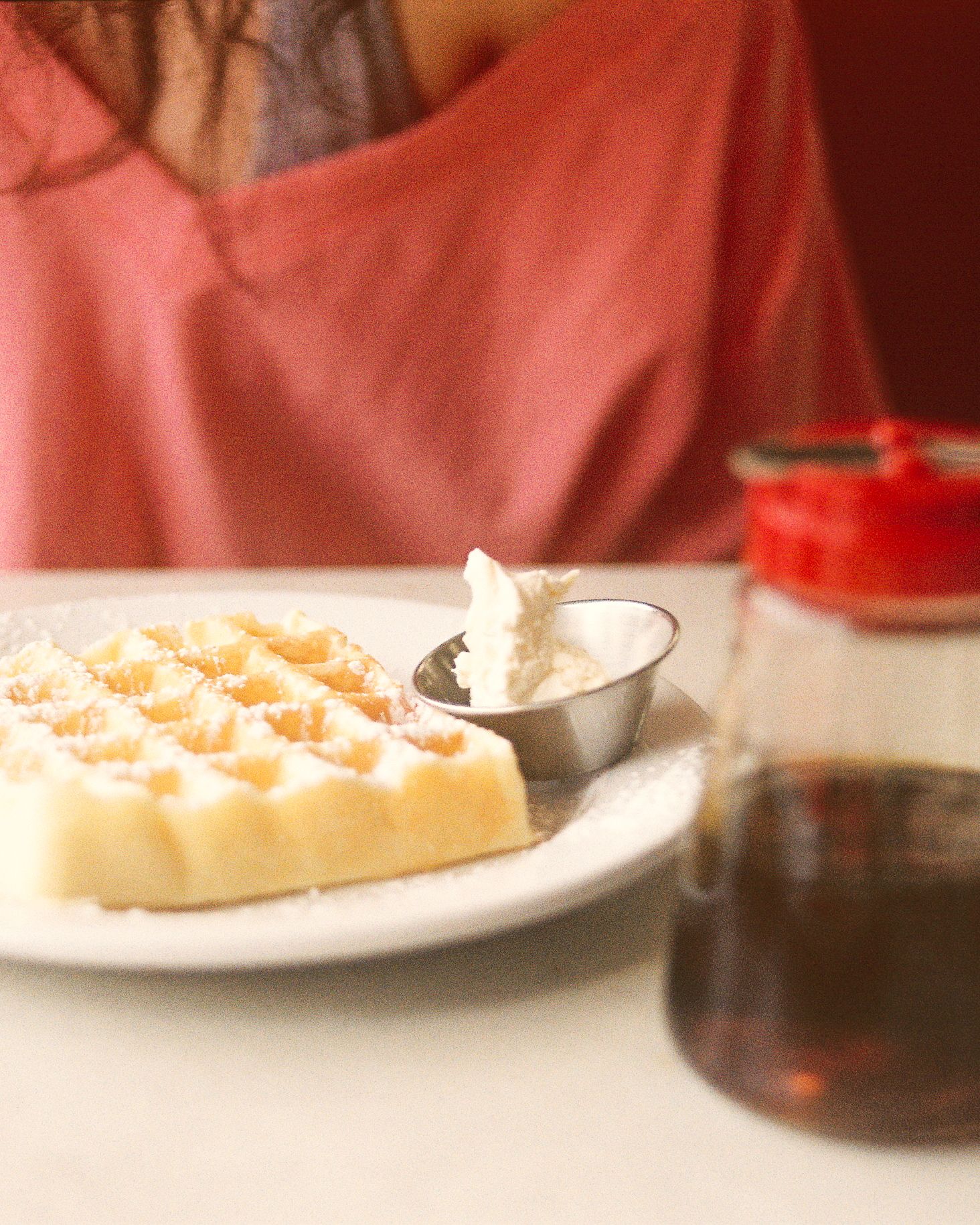 At The Corner's waffle, butter, and syrup.
