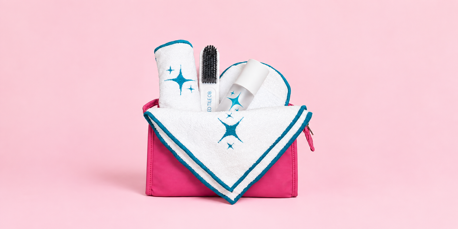 A studio product photo of a cleaning kit with a pink yellow backdrop.