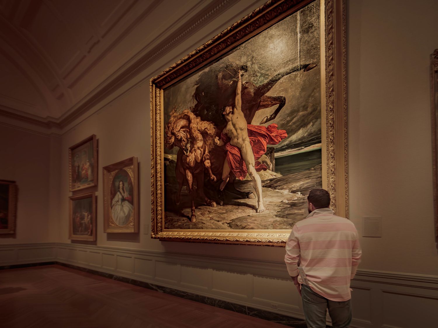 A candid moment of a man appreciating a painting, capturing a genuine sense of wonder and admiration