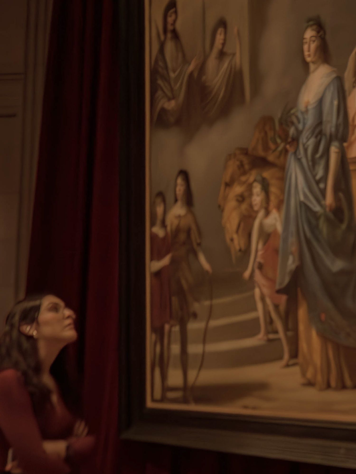 A candid moment of a woman appreciating a painting, capturing a genuine sense of wonder and admiration