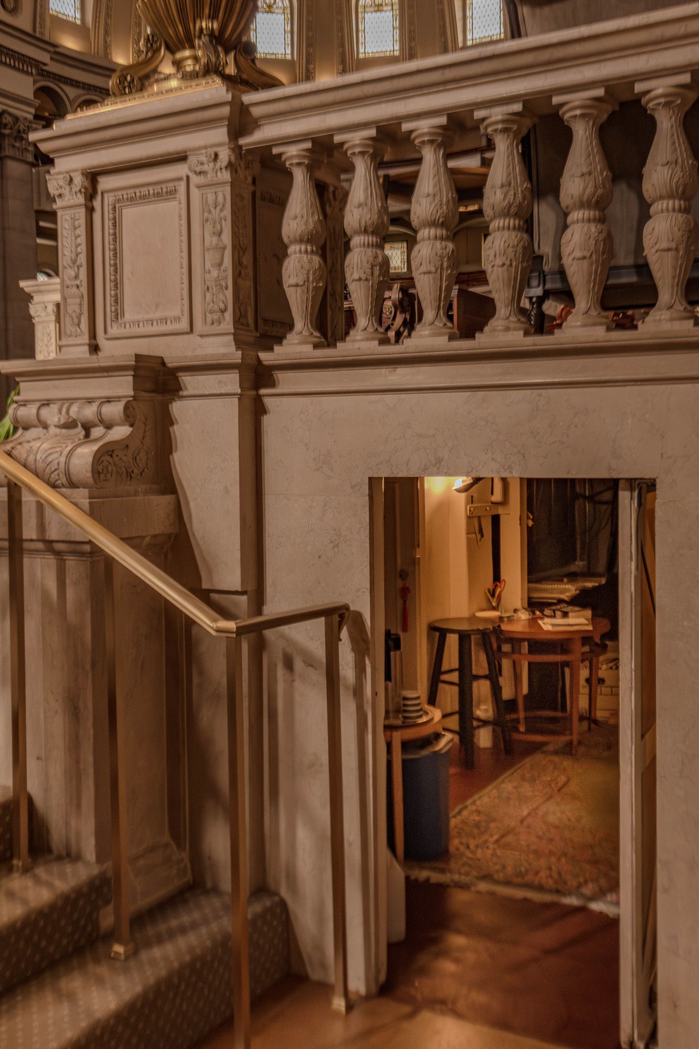A small room beneath the church stage where an organist enters.