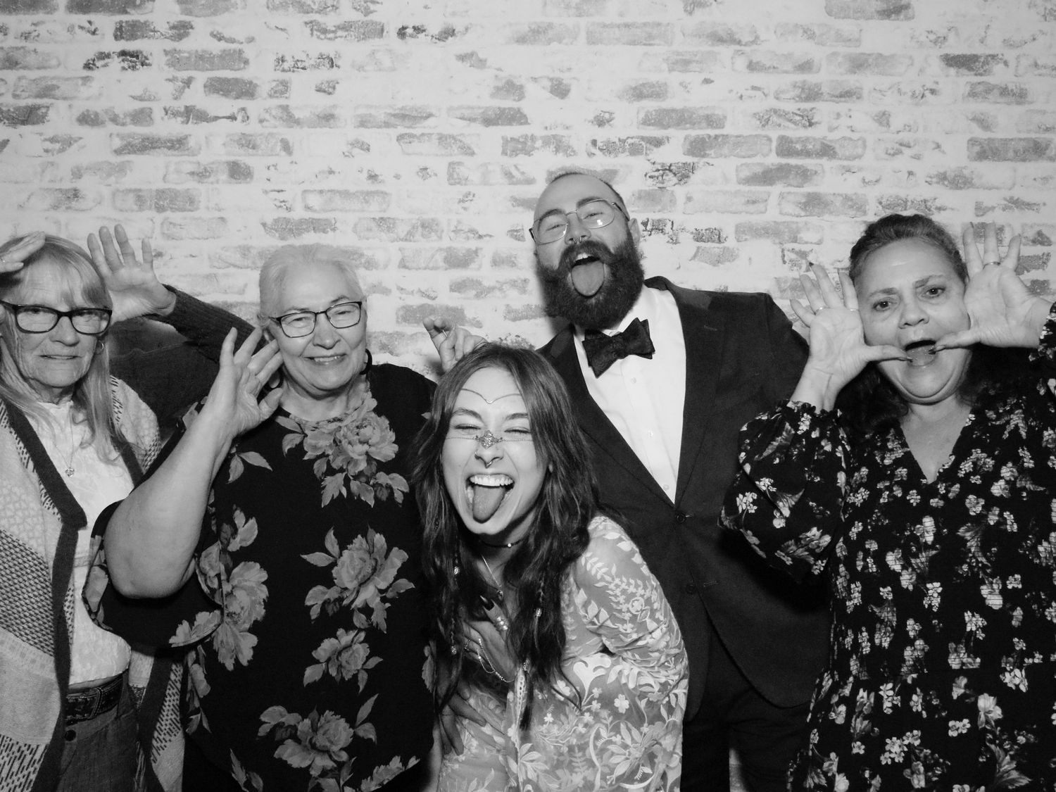 Collection of celebratory group shots with people laughing against textured wall.