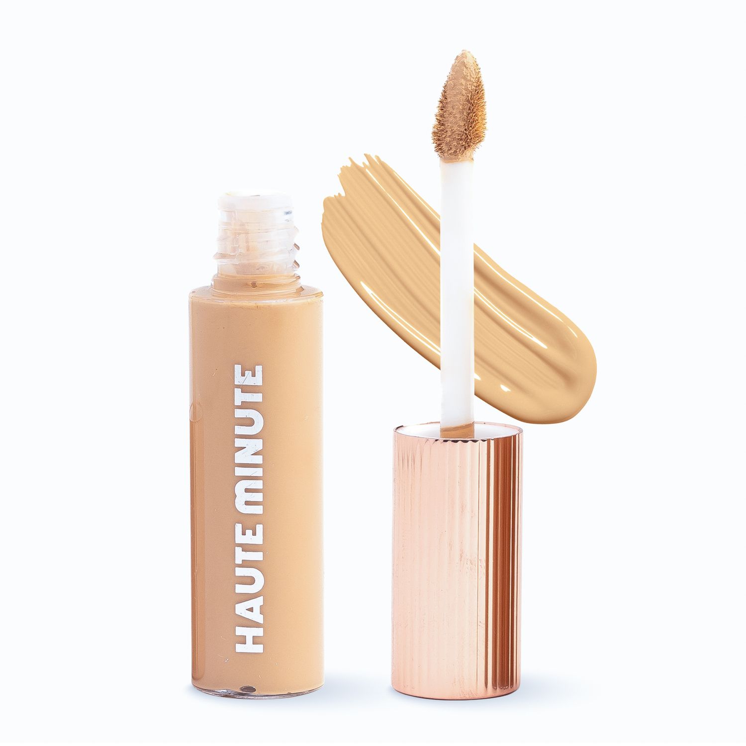 Rose gold makeup foundation bottles with metallic caps on white background.