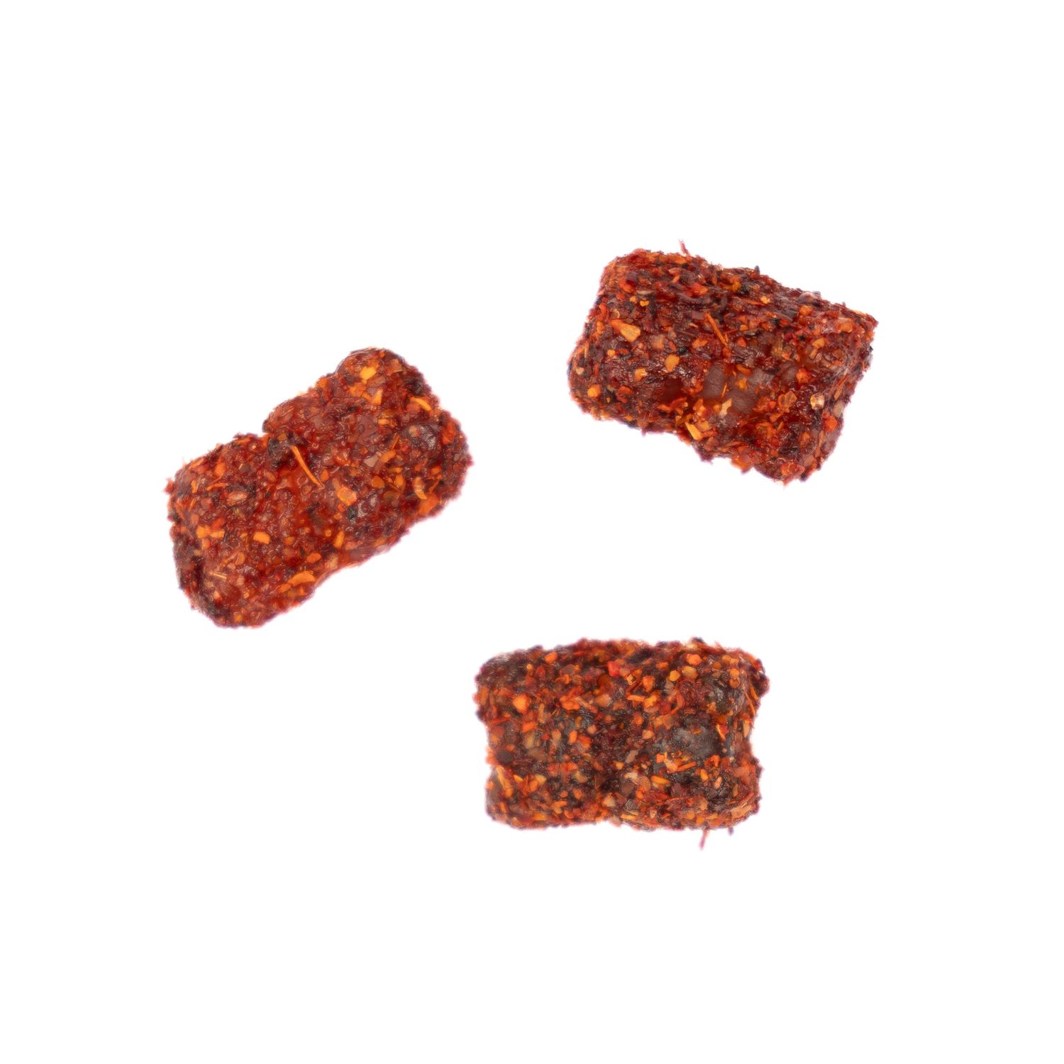 Three rectangular spicy-coated snacks arranged on white background.