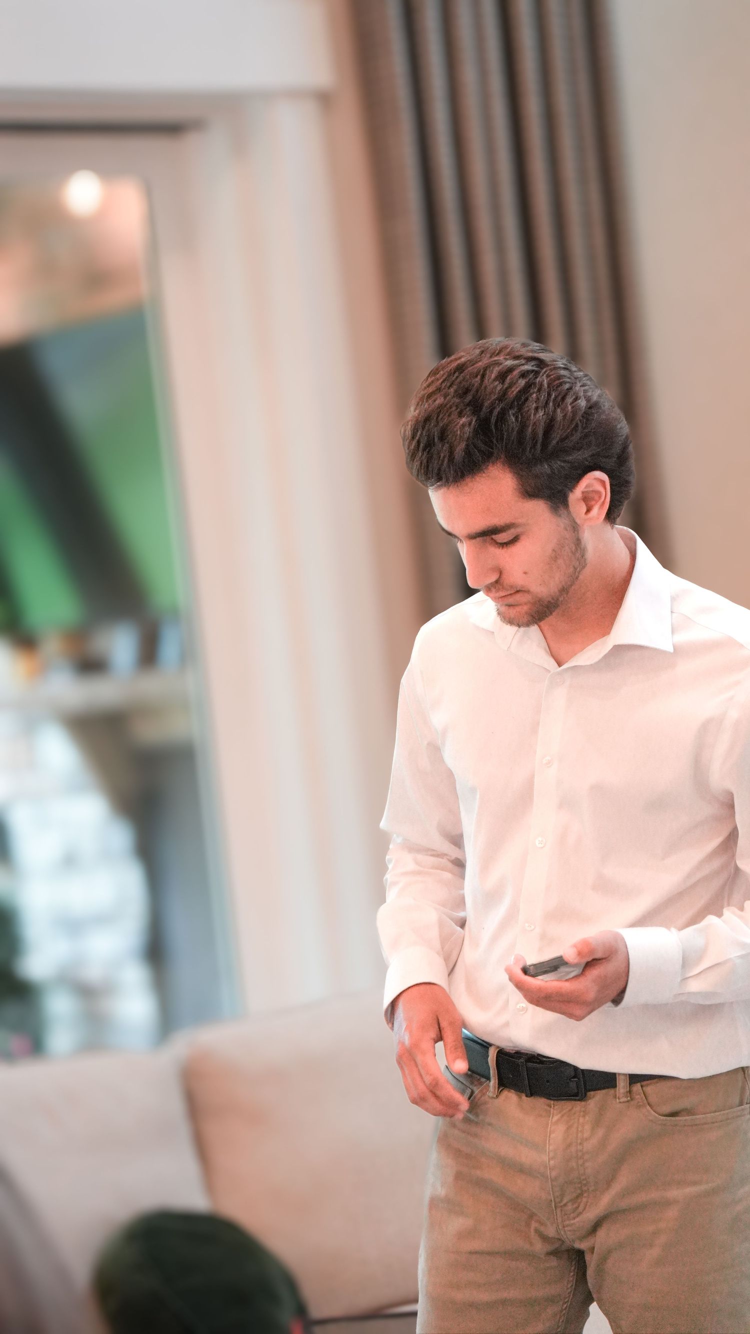 Young man in white button down shirt with khakis