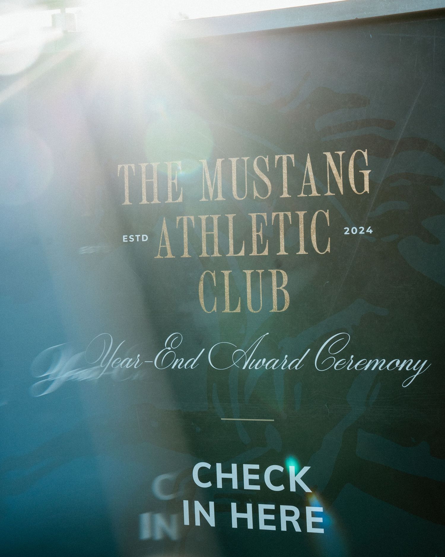 The Mustang Athletic Club Year-End Award Ceremony check-in sign established 2024.