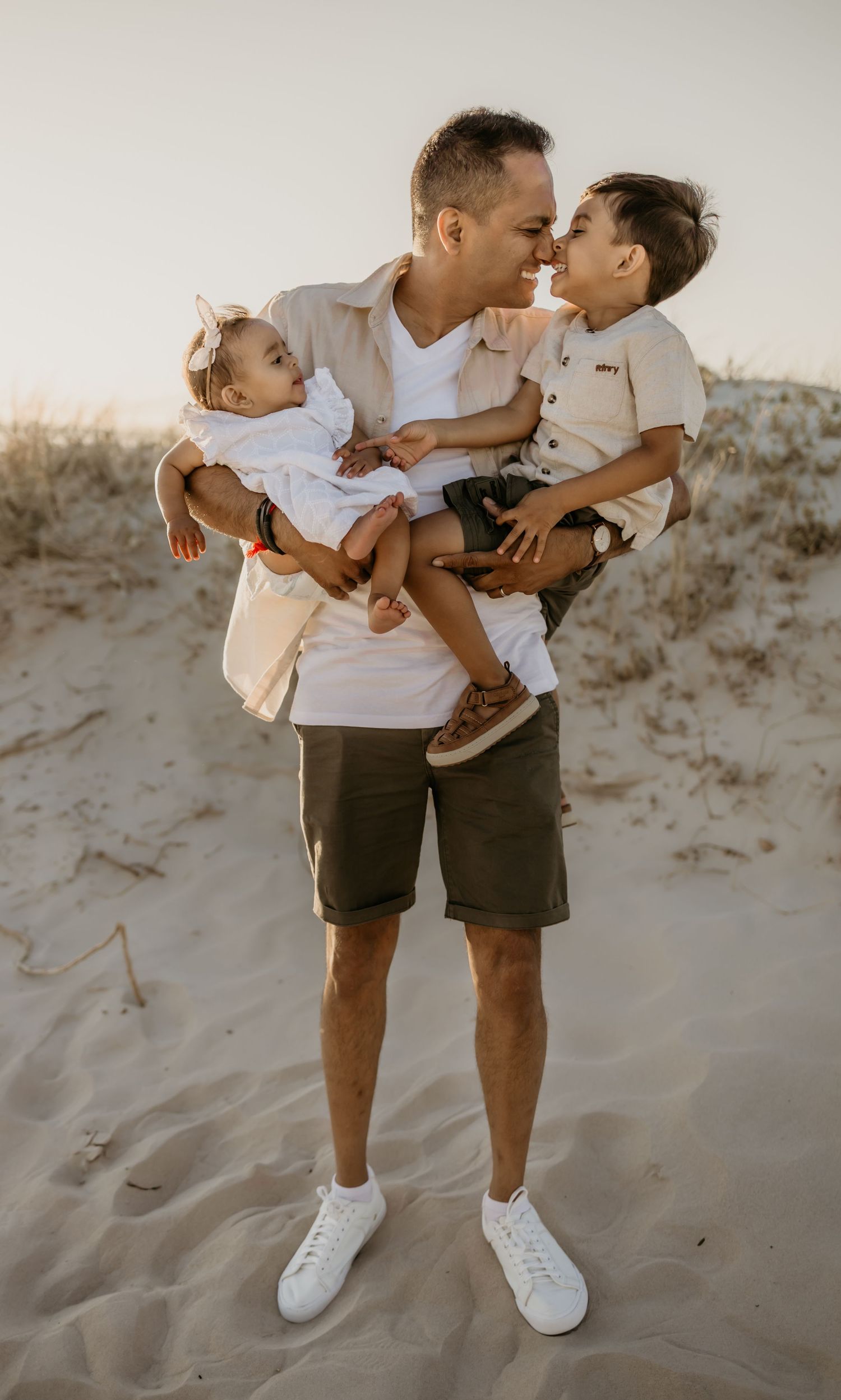 Beach family photoshoot in Strand at golden hour.

Sunset family photography in Cape Town.