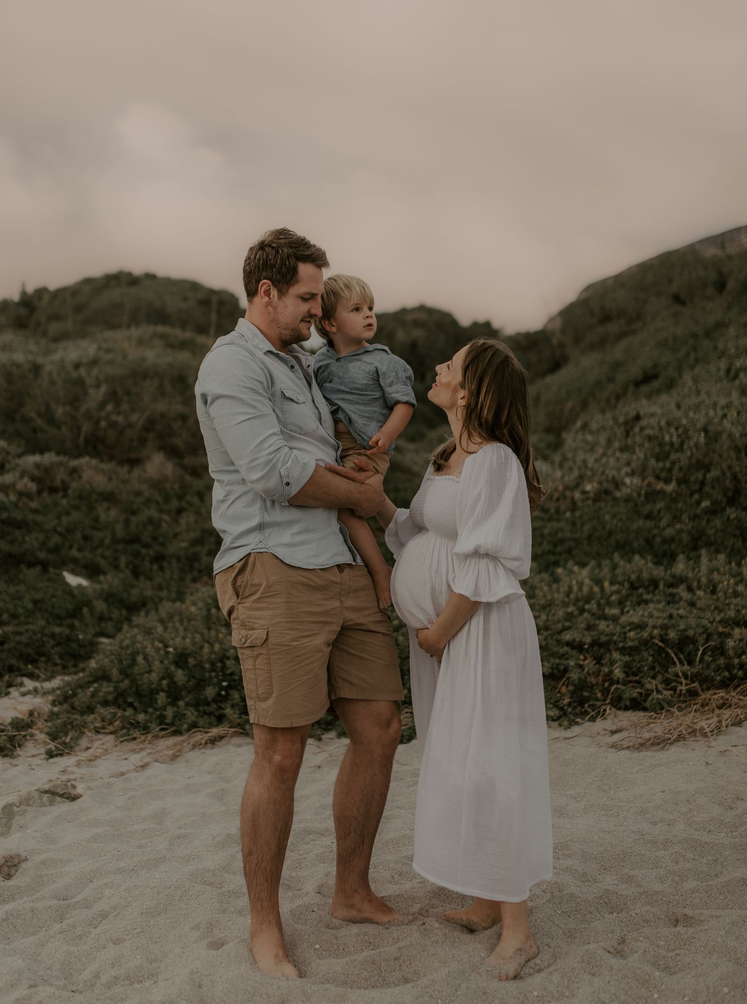 Pregnancy photographer Strand capturing authentic maternity moments against a beautiful coastal landscape.