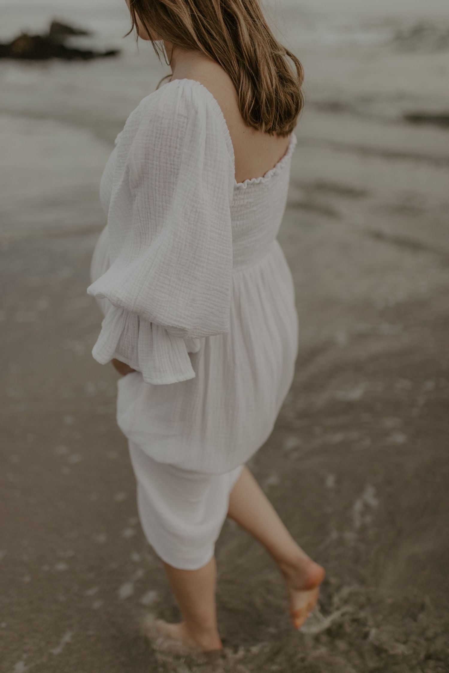 Natural pregnancy photography near Stellenbosch capturing an expectant mother in an elegant outdoor setting. CAP
E TOWN
