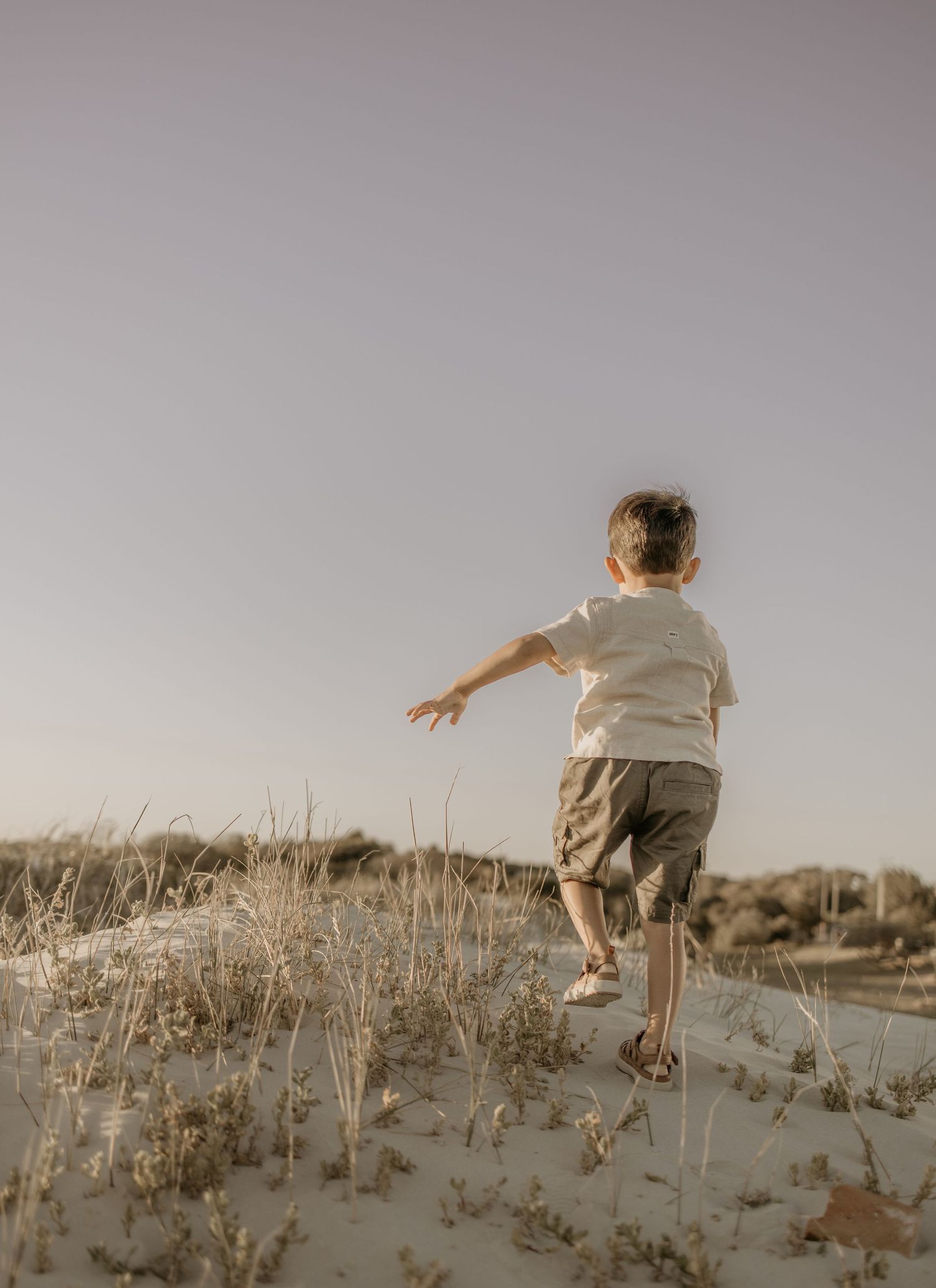 Beach family photoshoot in Strand at golden hour.

Sunset family photography in Cape Town.