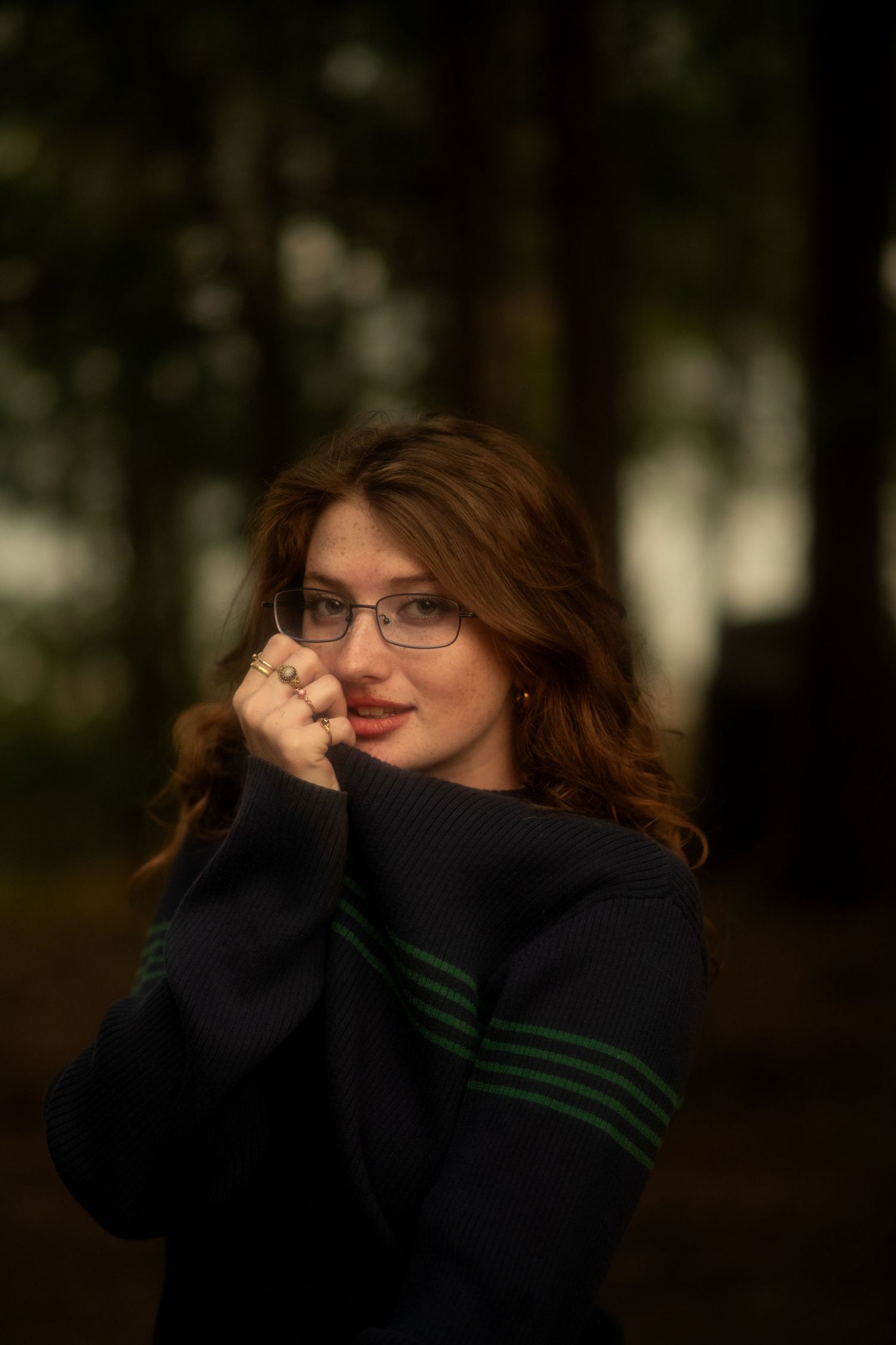 moody portrait of a girl in the woods.