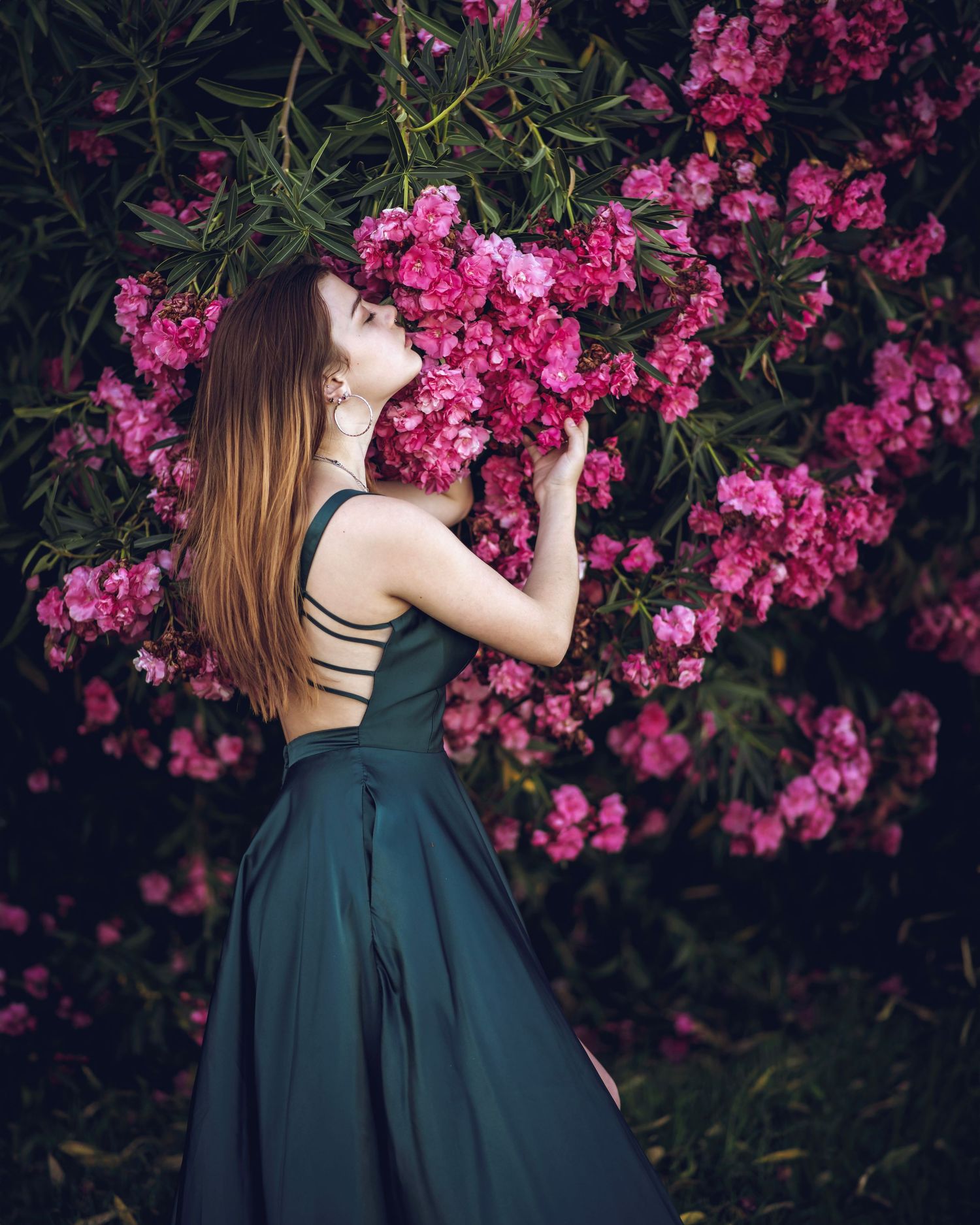 pink floral portrait with girl in green/blue dress.