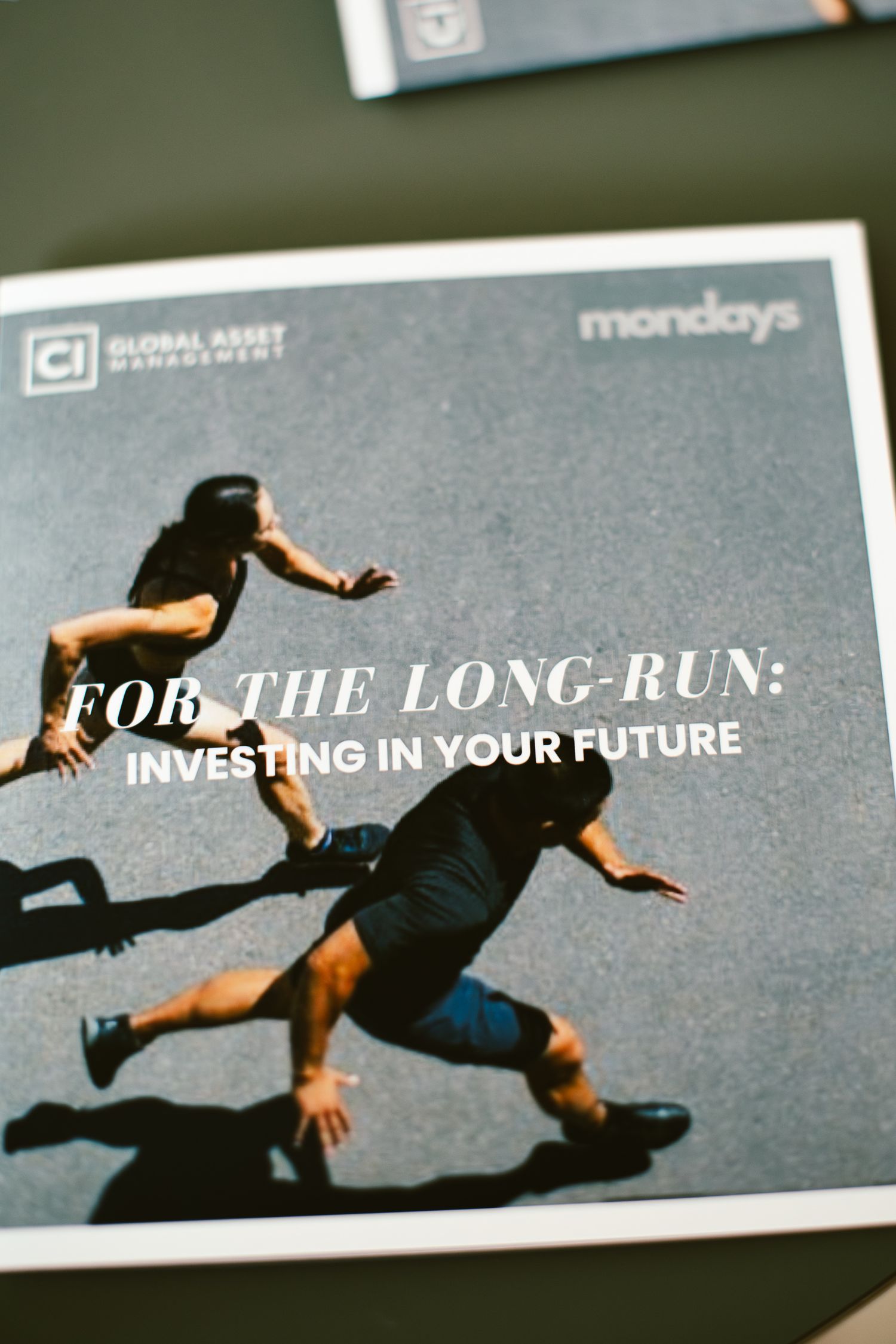 CI Global Asset Management brochure titled For The Long-Run: Investing In Your Future featuring two runners on cover.