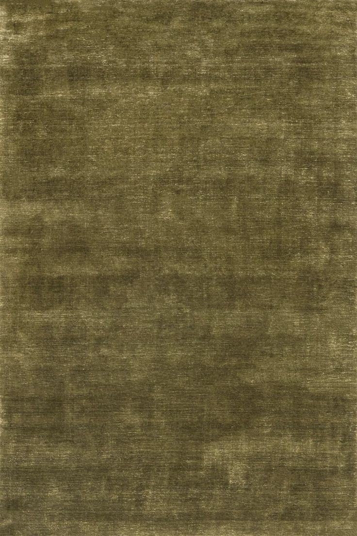Close-up of a luxurious olive green textured area rug with subtle sheen and distressed woven pattern.
