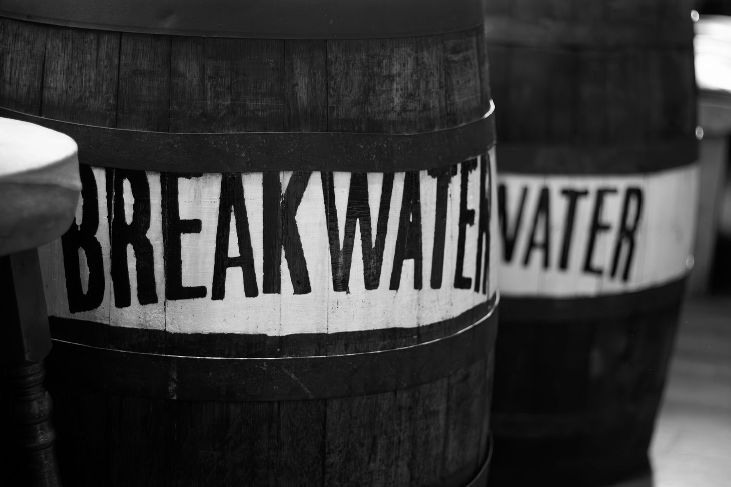 Black and white text reading 'Break Water' on a dark background.