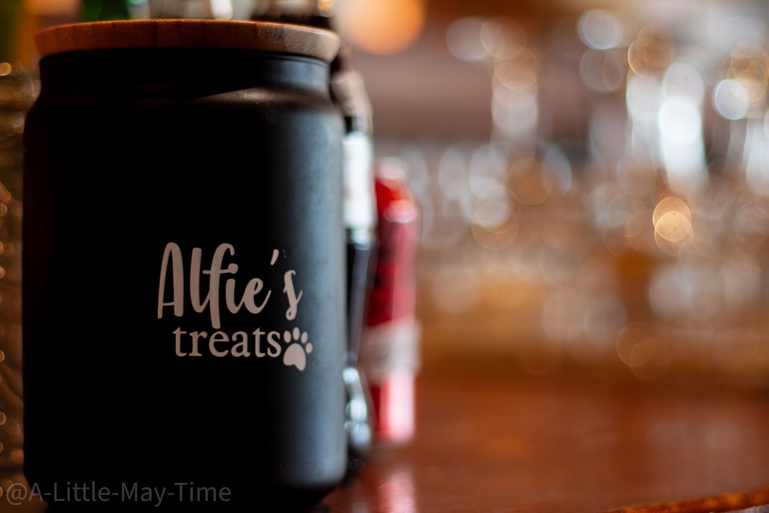 Blurred bokeh lights create warm ambiance in restaurant or bar setting.