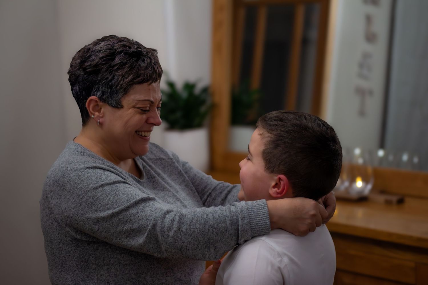 A heartwarming family moment shared in an indoor setting.
